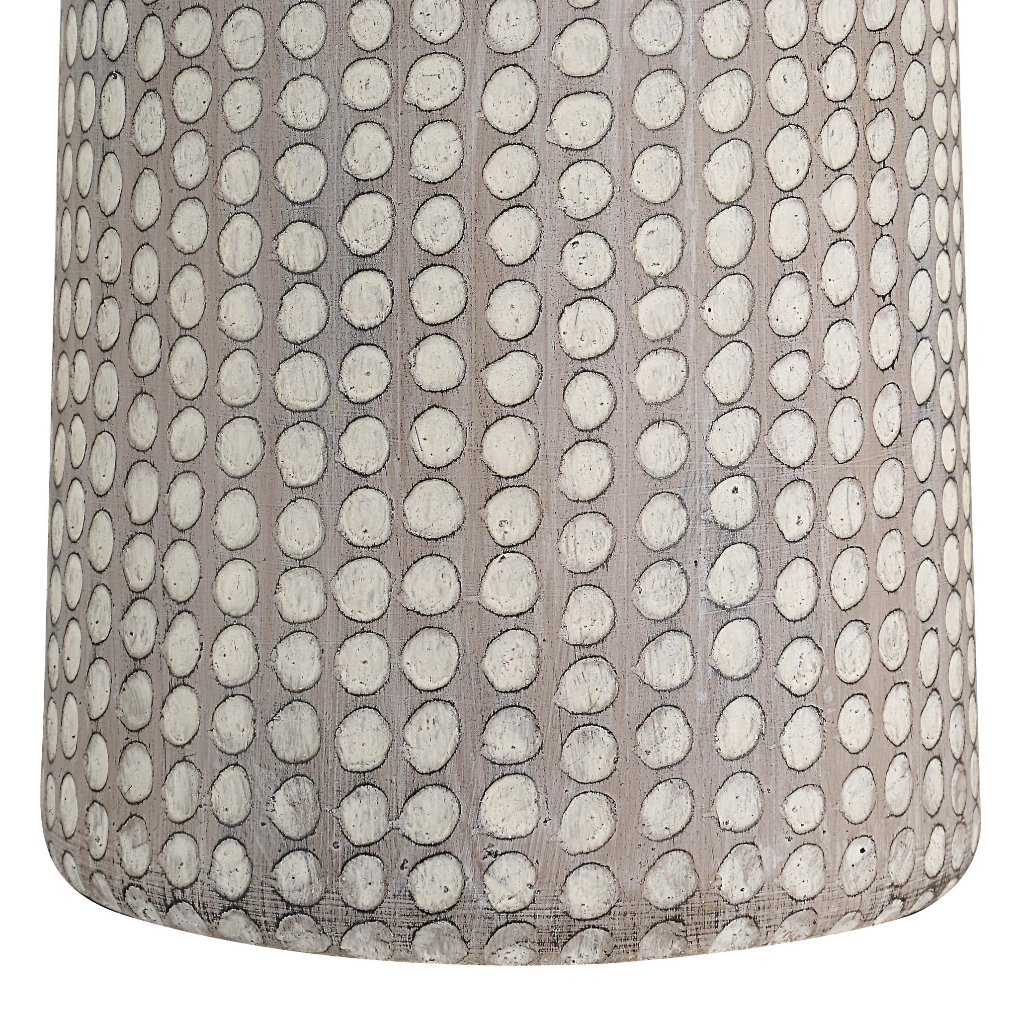Close-up of Lechuga Table Lamp's textured ceramic base with a dotted design in light gray.