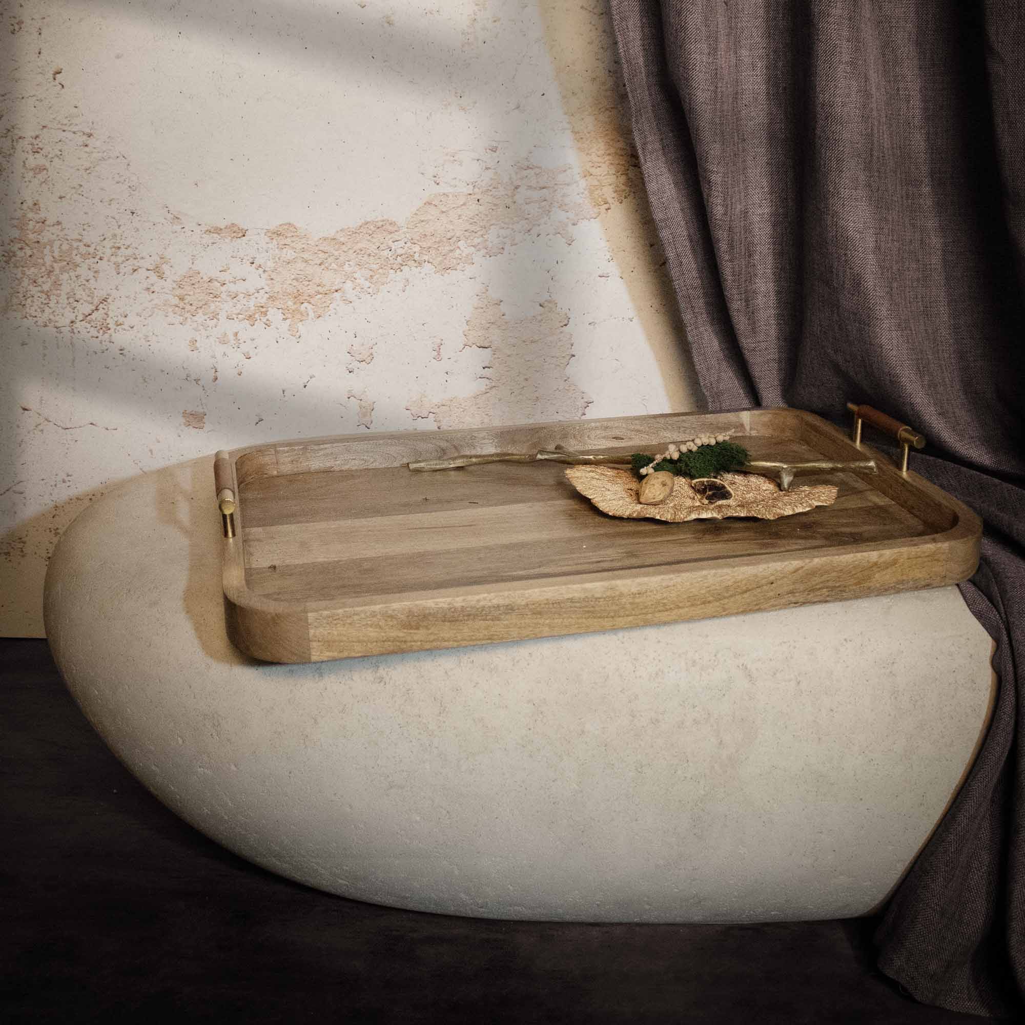 Mango Tray by Renwil, styled on a decorative surface with natural elements.