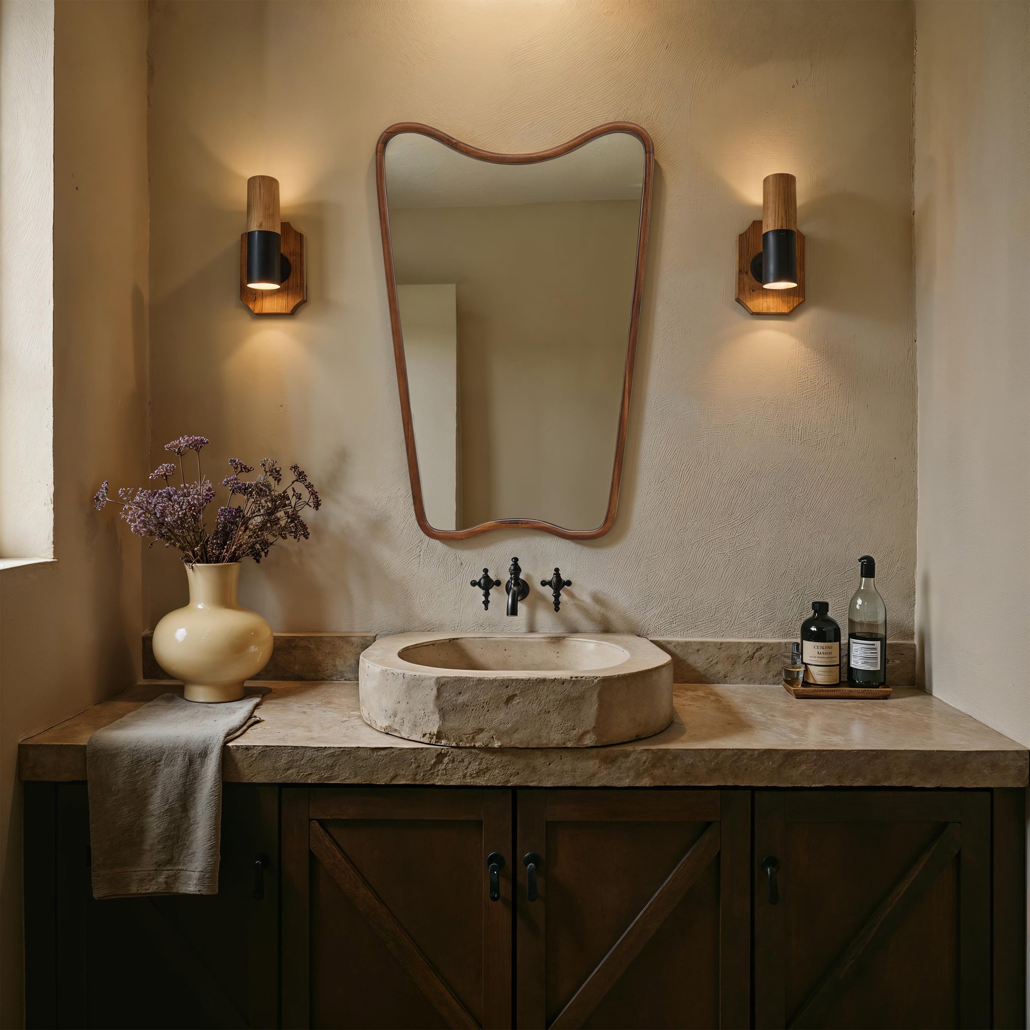 Reverie mirror above a stone sink in a stylish bathroom setting
