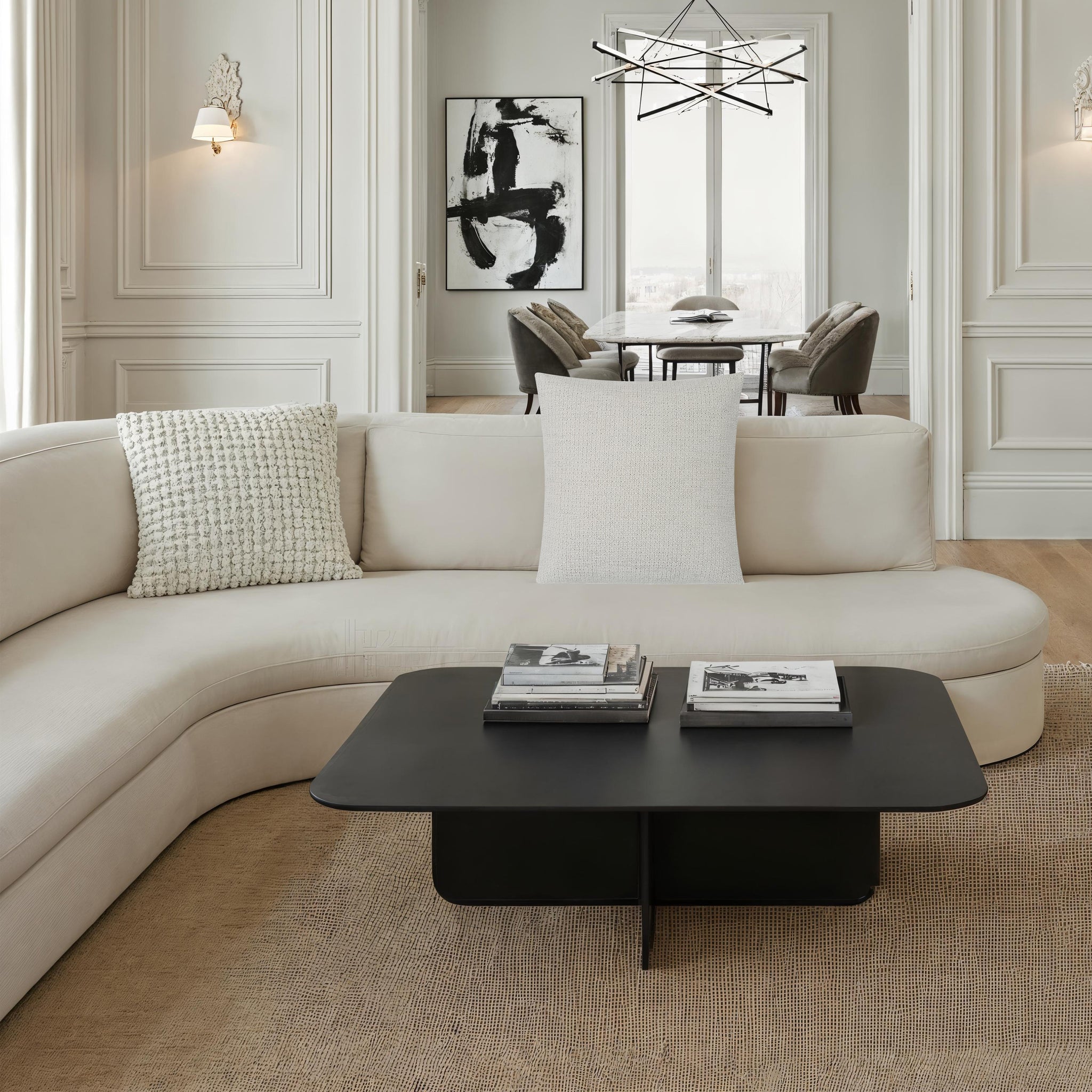 Bolero indoor pillow on a modern beige sectional sofa in a stylish living room.