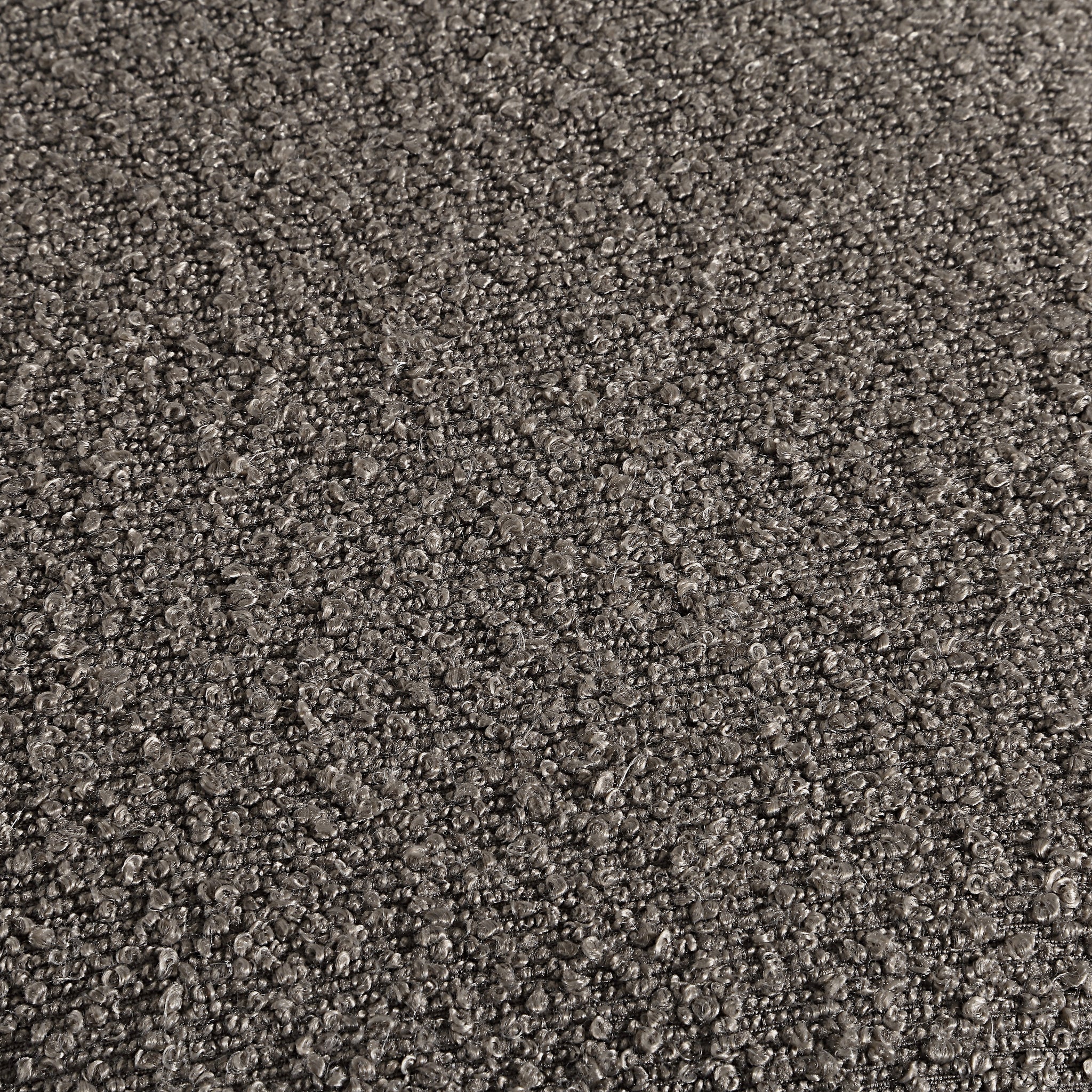 Close-up view of Amarion stool's dark gray fabric texture, showcasing its unique surface pattern
