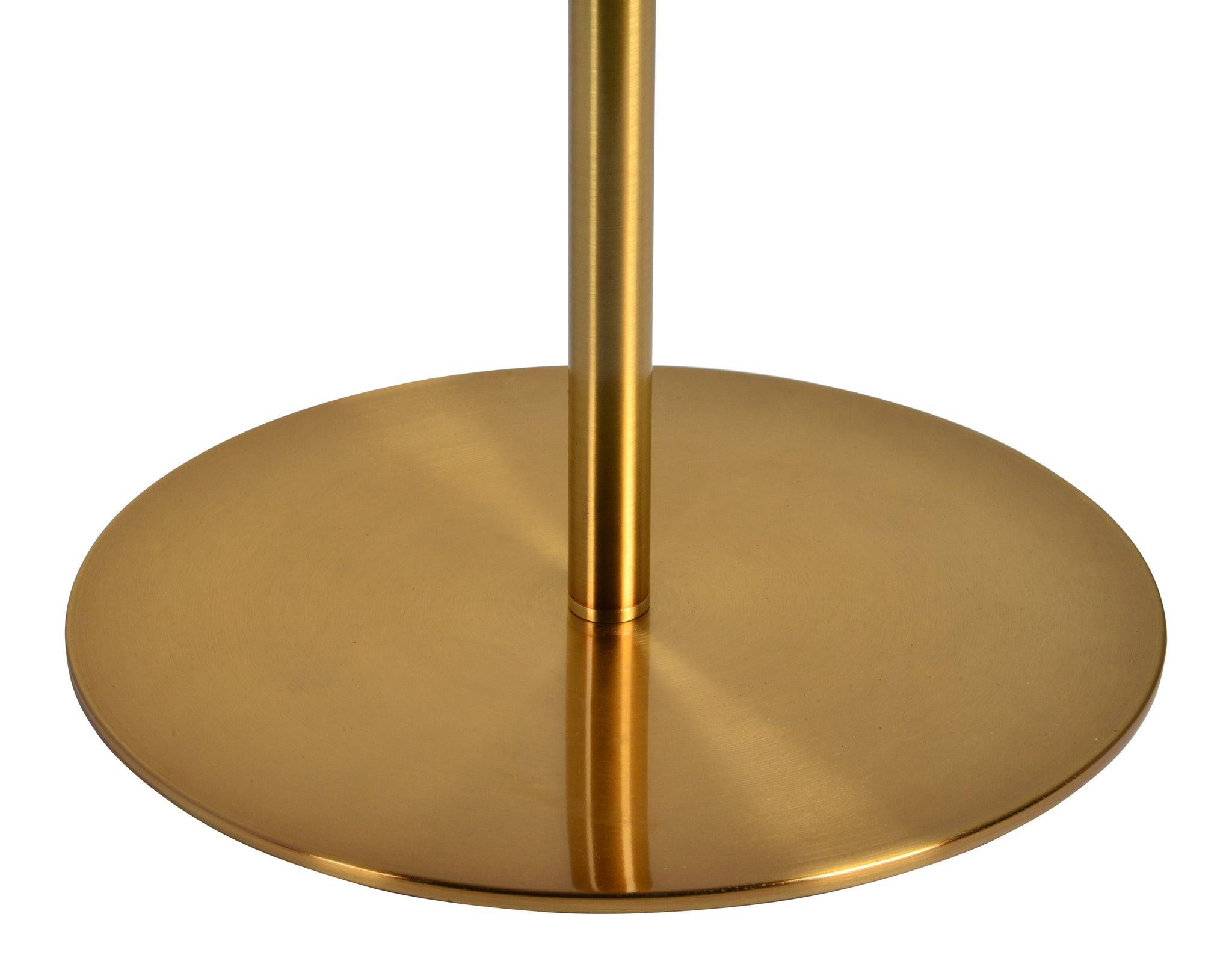 Close-up of the gold metal base of the Radison Floor Lamp, featuring a circular design.