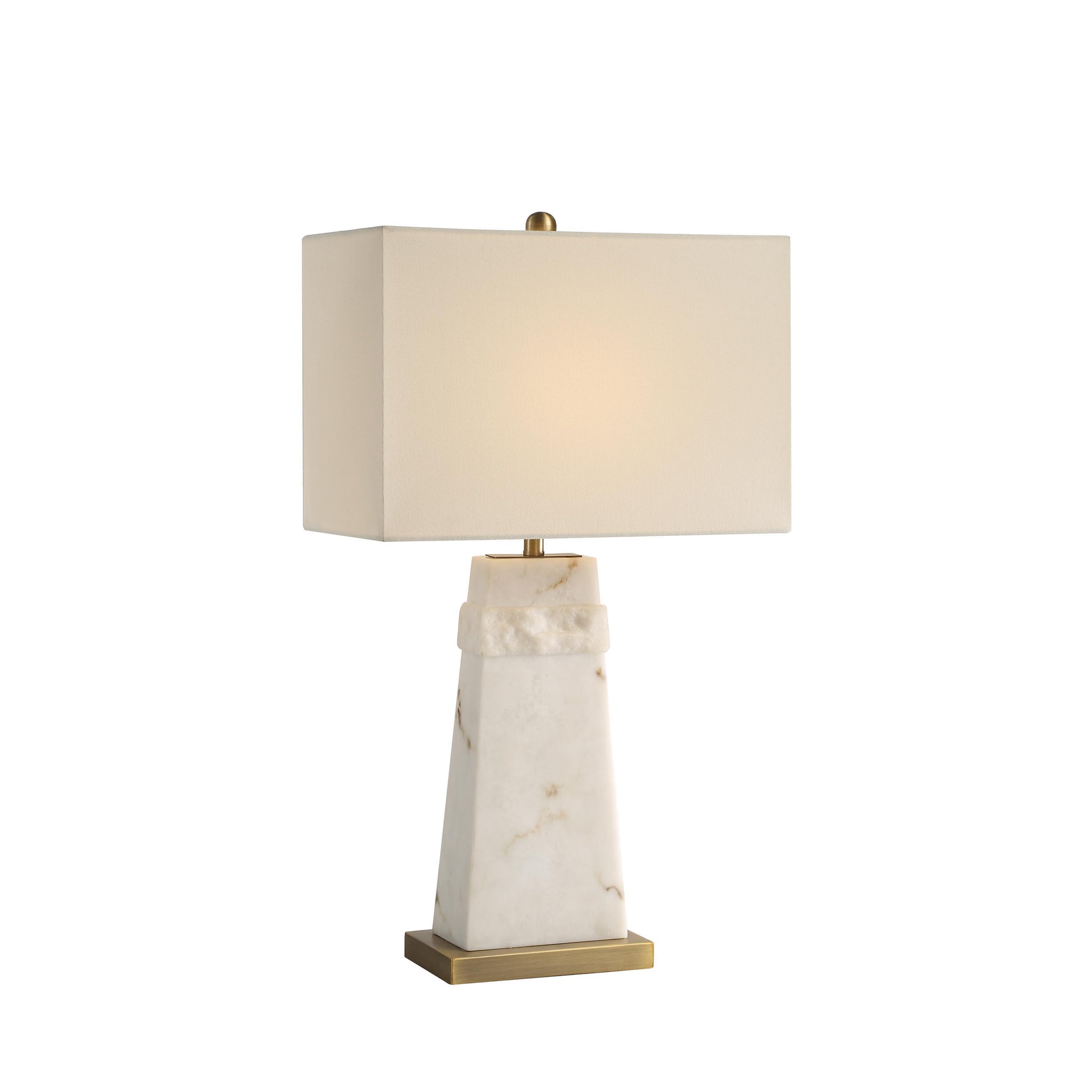 Nisrine Table Lamp illuminated, featuring a white shade and marble base with gold accents