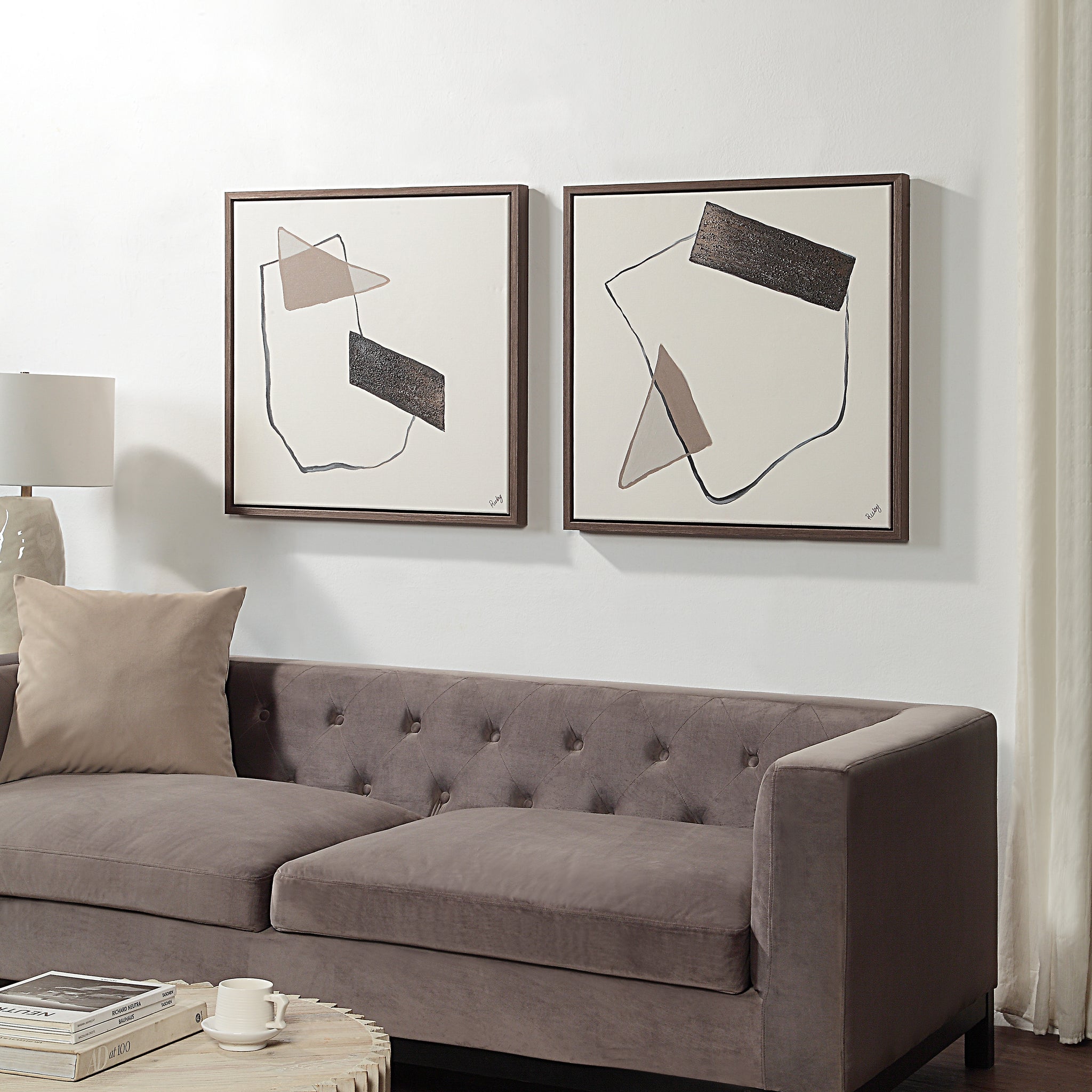 Lacadie Canvas Art displayed above a modern sofa in a stylish living room setting