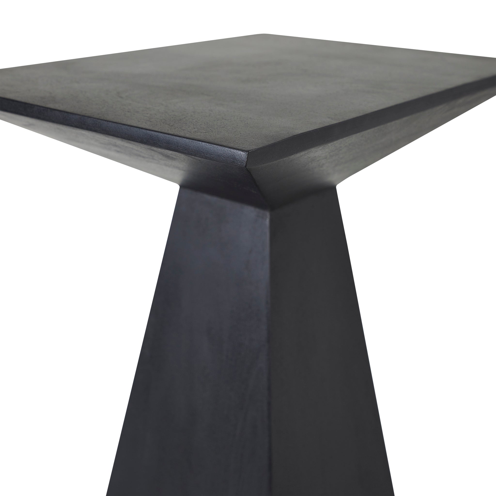 Close-up of the Moulin Side Table in black, highlighting its sharp edges and smooth surface.