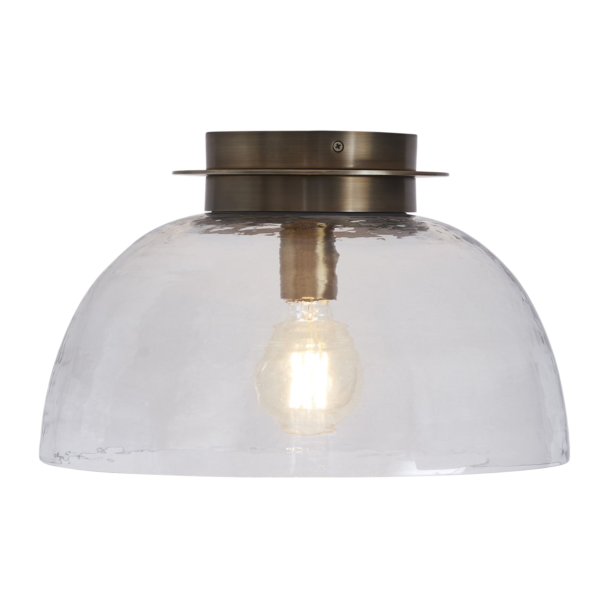 Liliane Flush Mount light featuring a clear glass dome and illuminated bulb, front view.