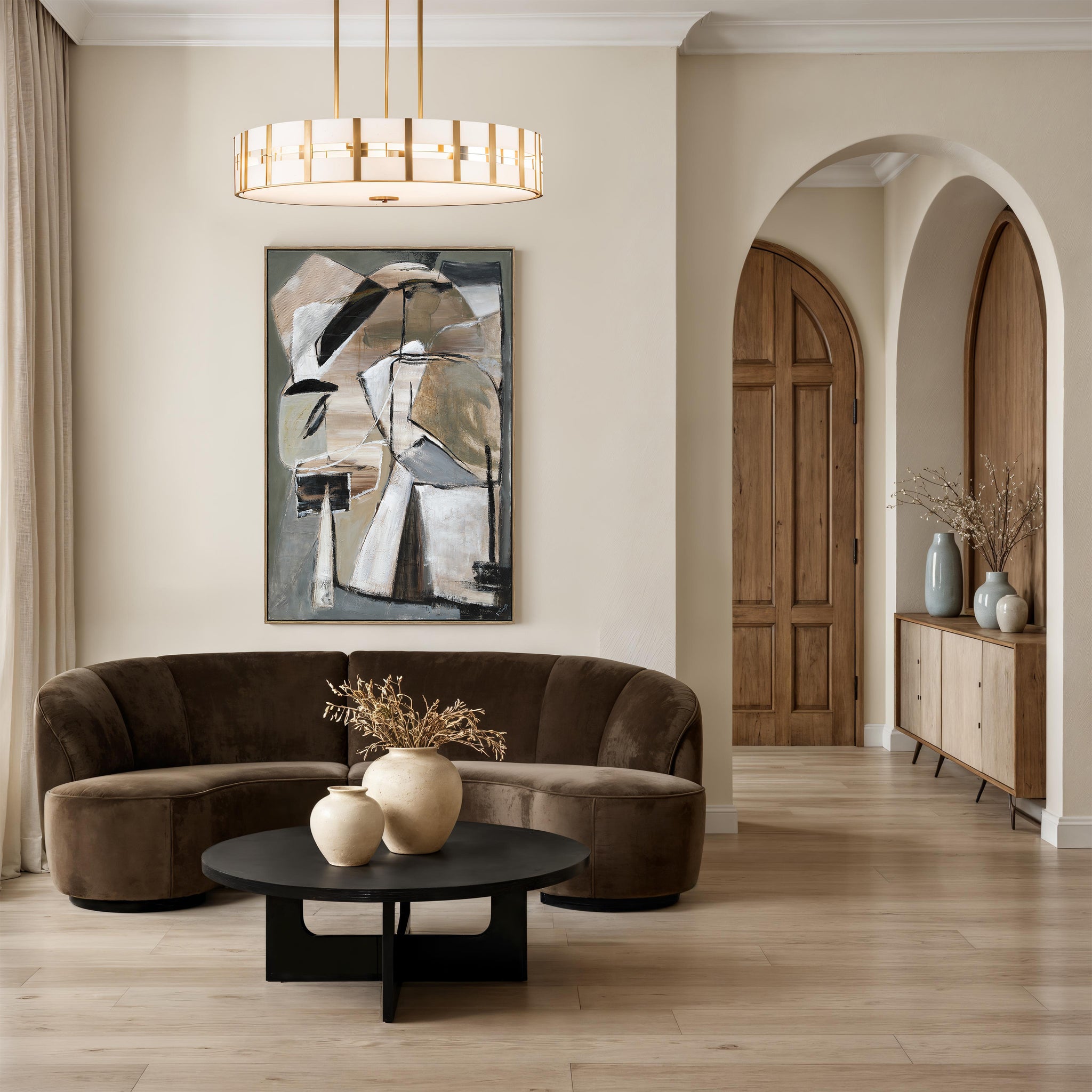 Pascal canvas art displayed in a modern living room with a curved sofa and decorative vases.