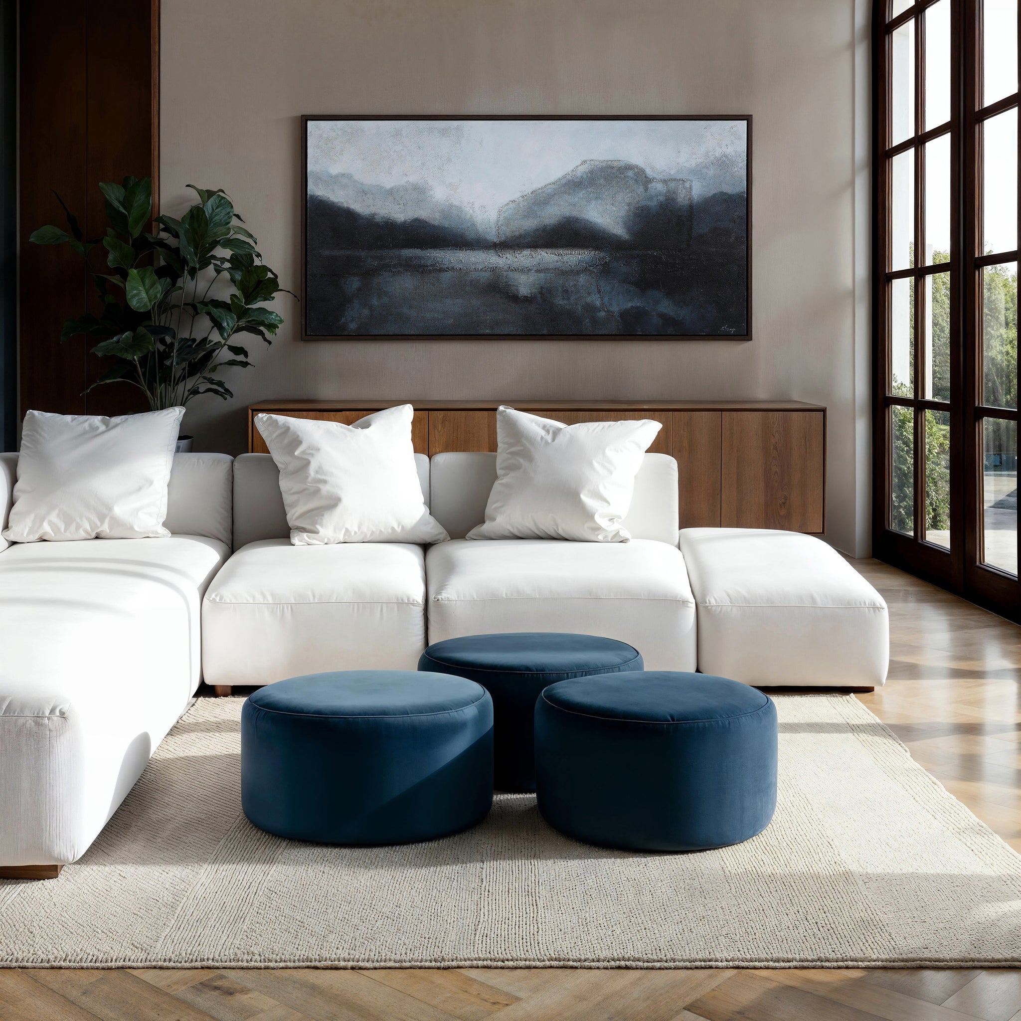 Atlanta canvas art by Renwil featuring abstract landscape in gray and blue tones above a white sofa