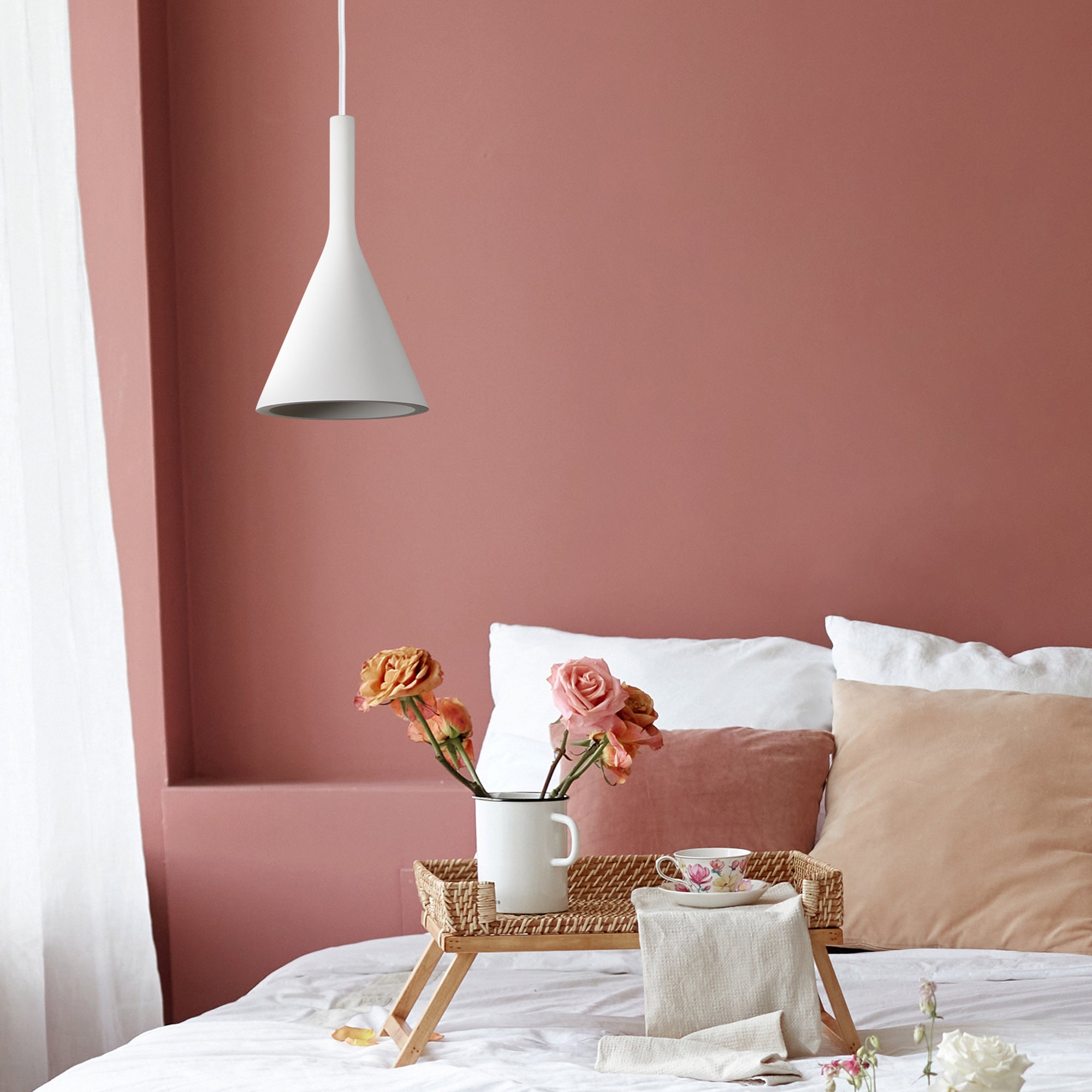 Hottah Ceiling Fixture in white above a bed with flowers and decorative items