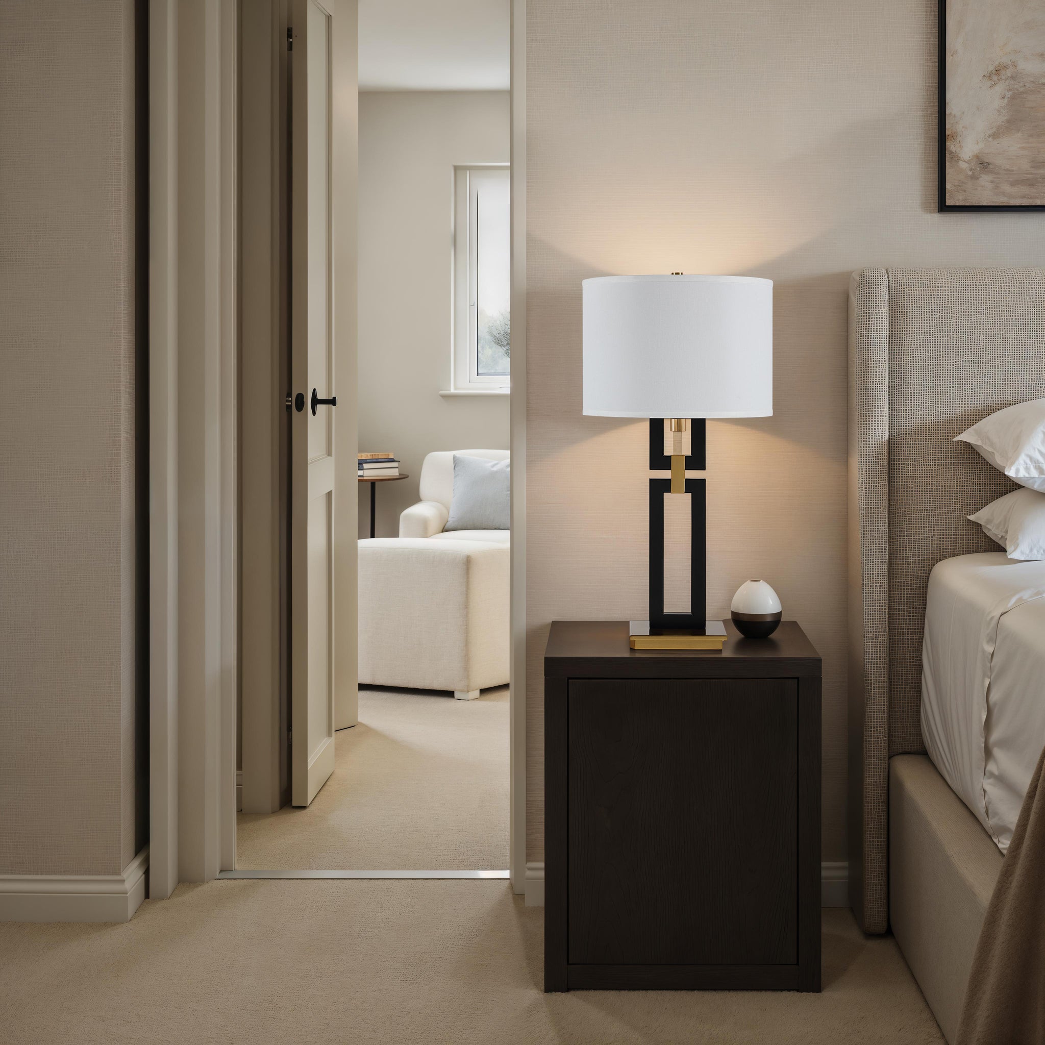 Lila Table Lamp on a nightstand in a cozy bedroom with neutral tones.