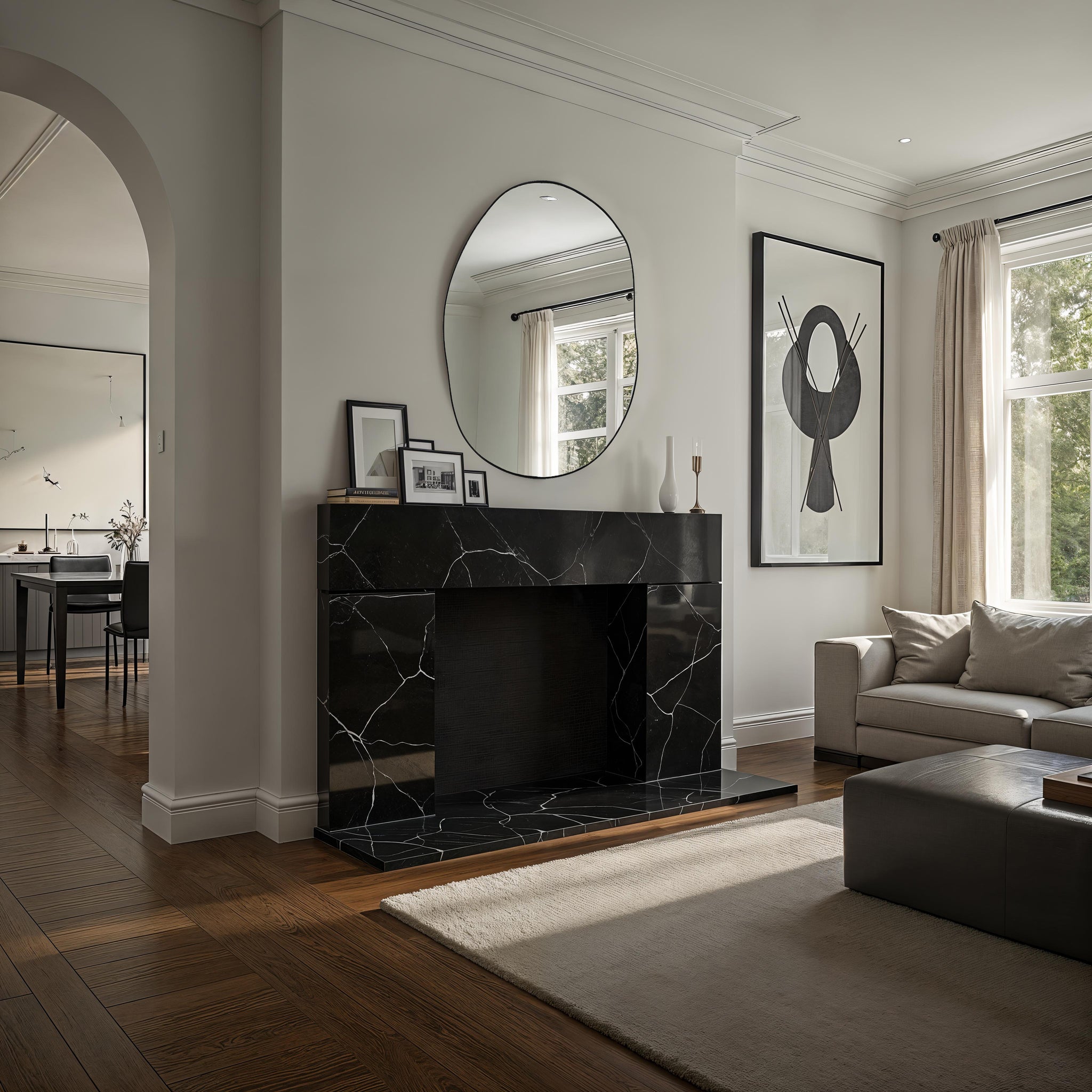 Messini mirror displayed above a black marble fireplace in a modern living room.