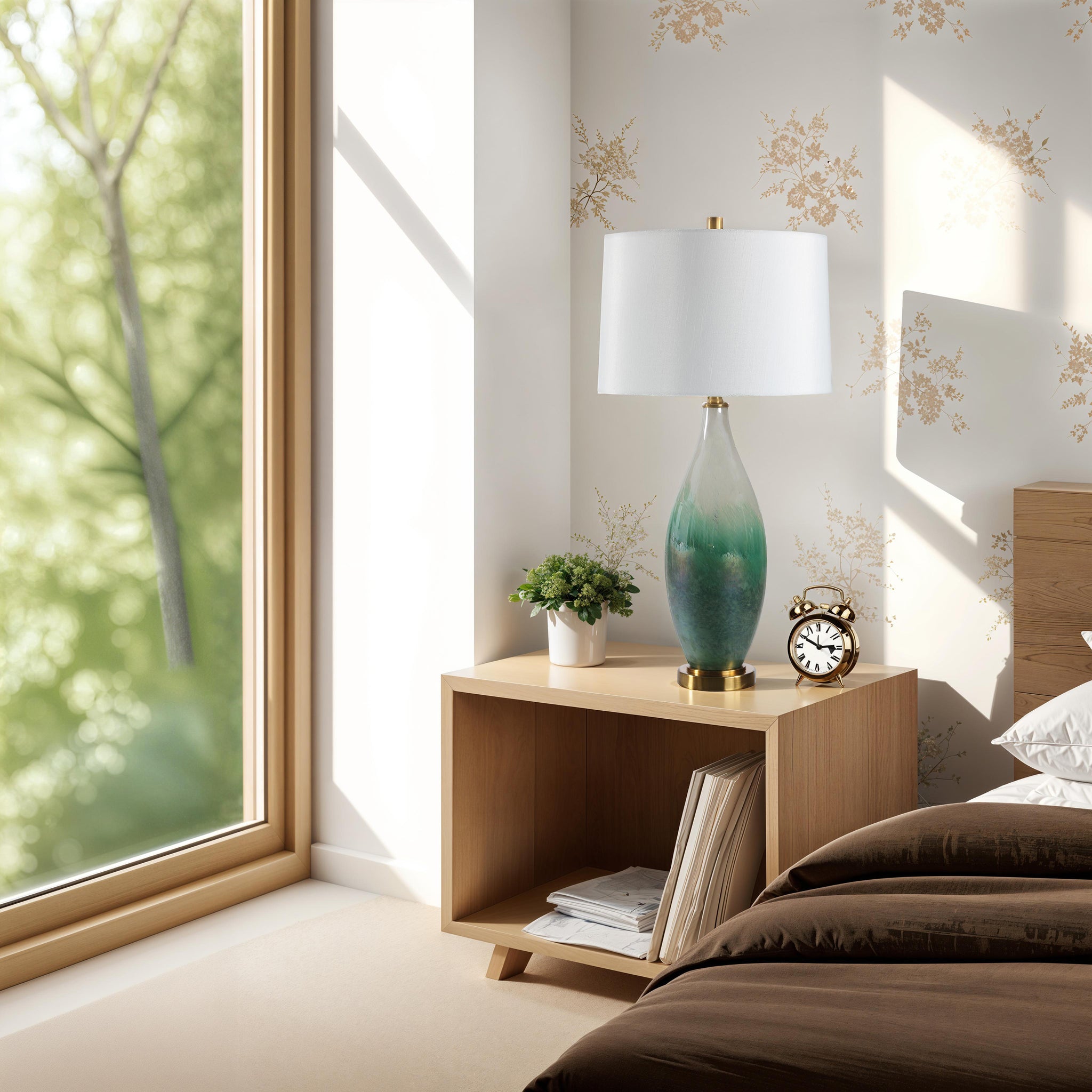 Wave table lamp on a nightstand in a bedroom, featuring a green glass base and white shade