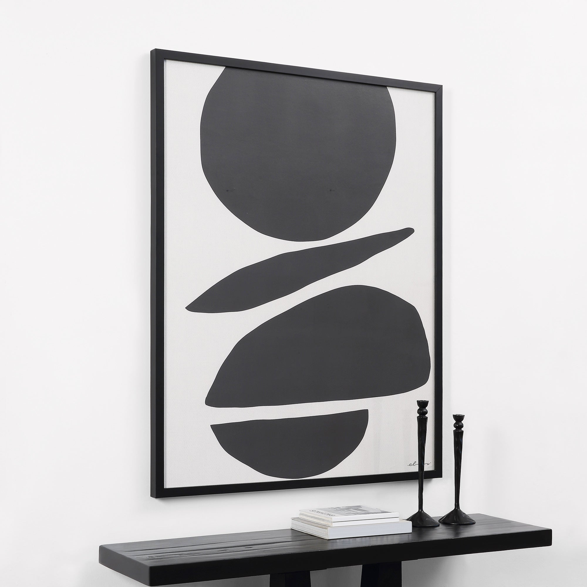 Cercola wall art displayed in a modern setting, framed in black with a black table and decor.