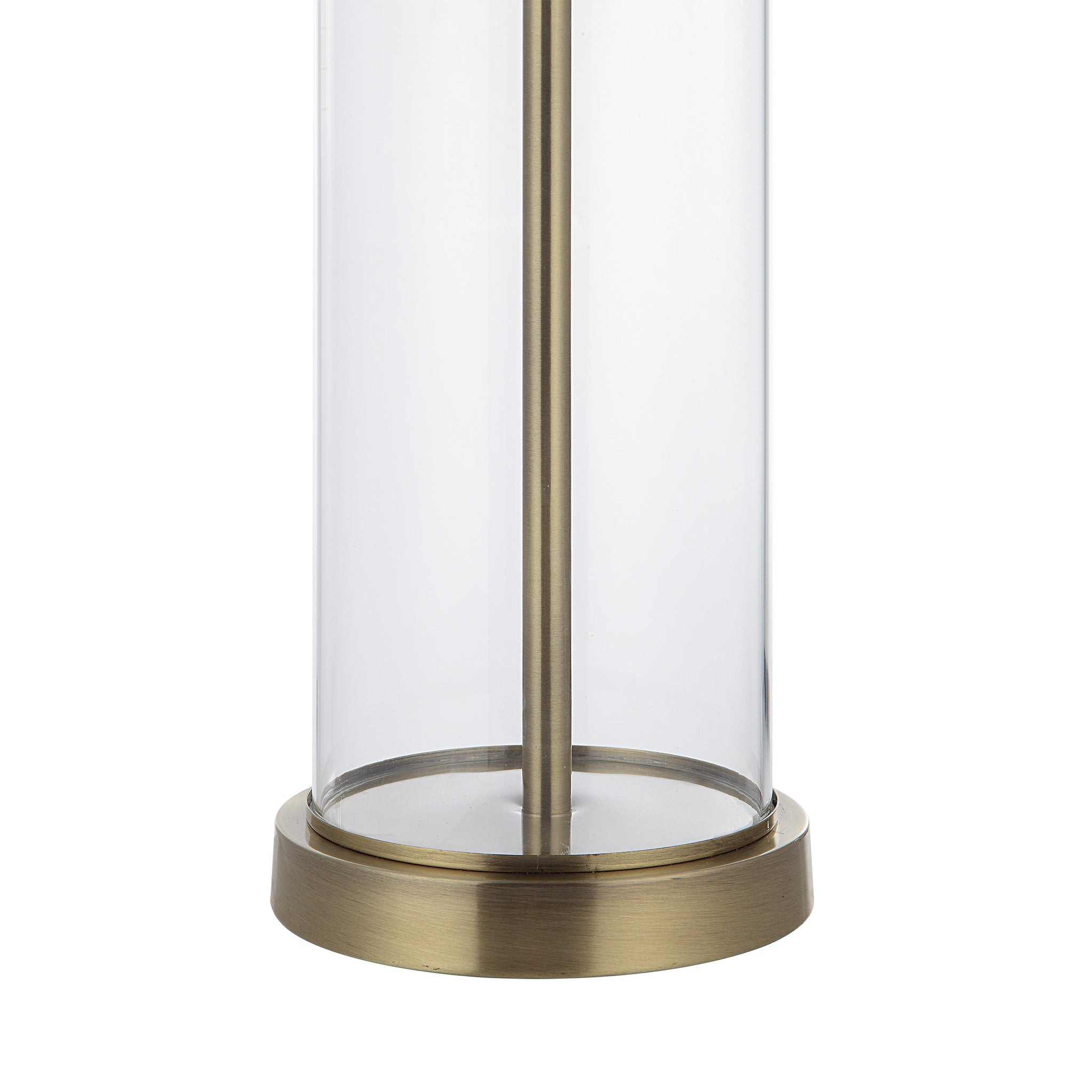 Close-up of Saco Table Lamp featuring a clear glass base and brass accents