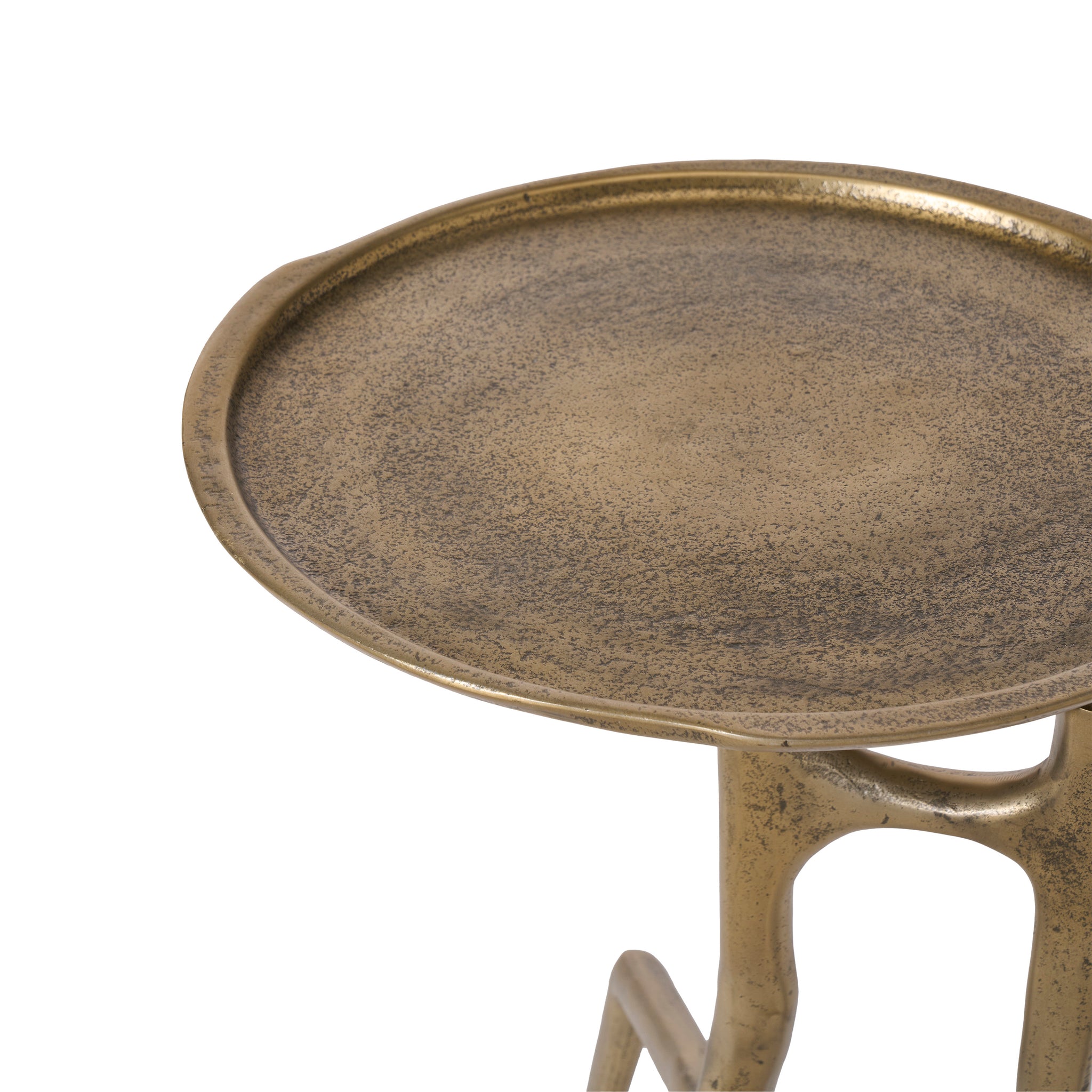 Close-up of the Tosca table's round top, highlighting its textured gold surface.