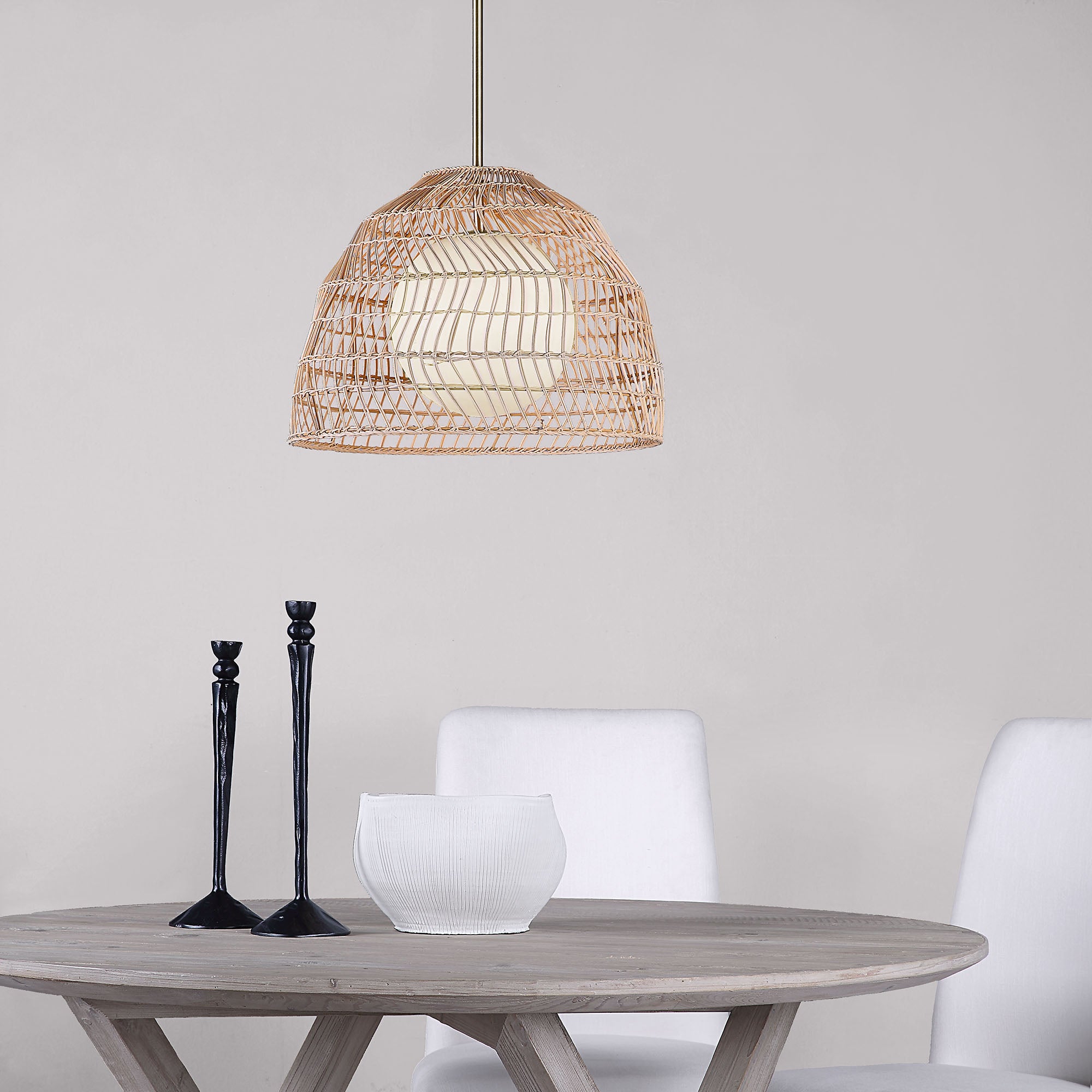 Palm Ceiling Fixture above a wooden table, with black candlesticks and a white bowl.