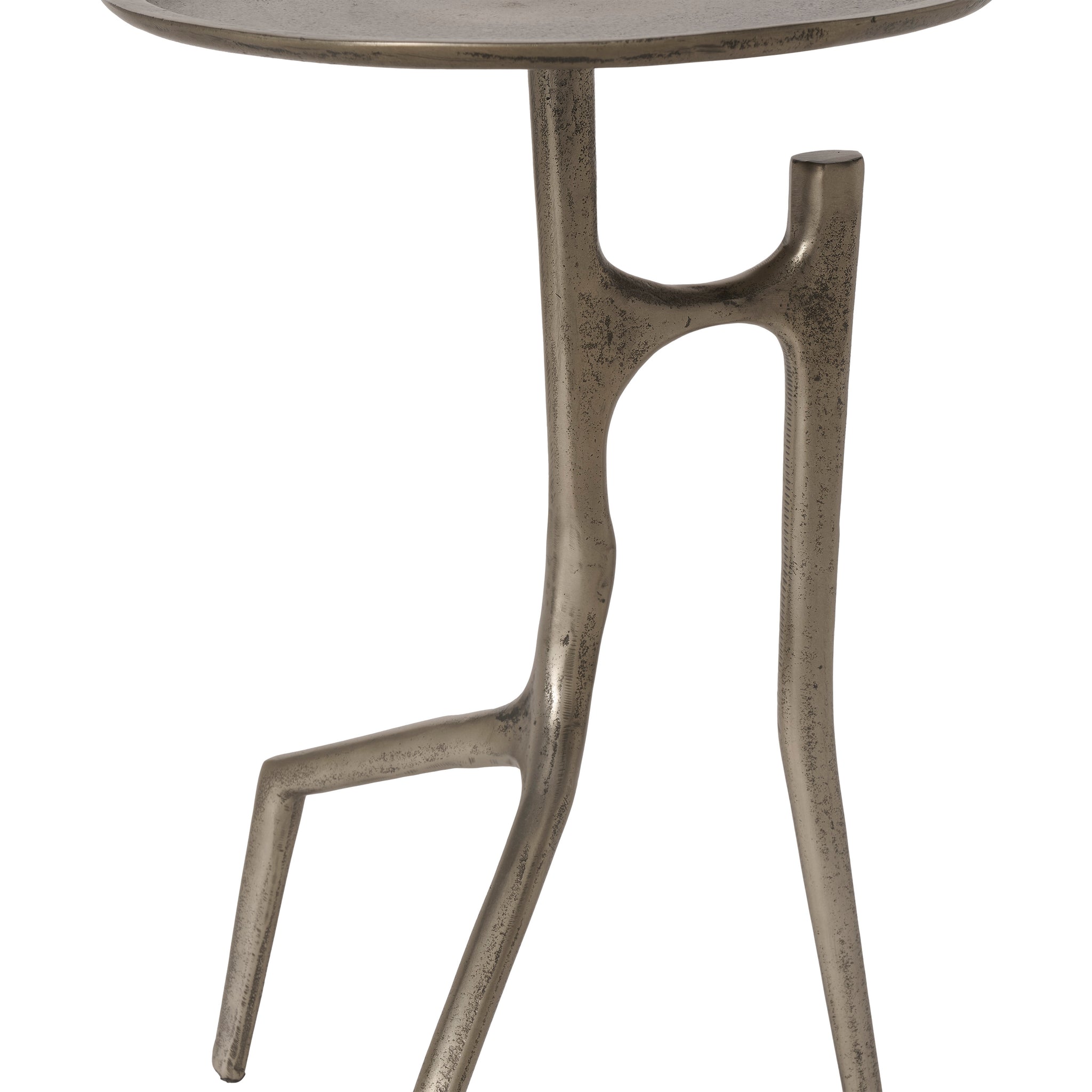 Tosco table featuring a round metallic top and artistic leg structure in silver.