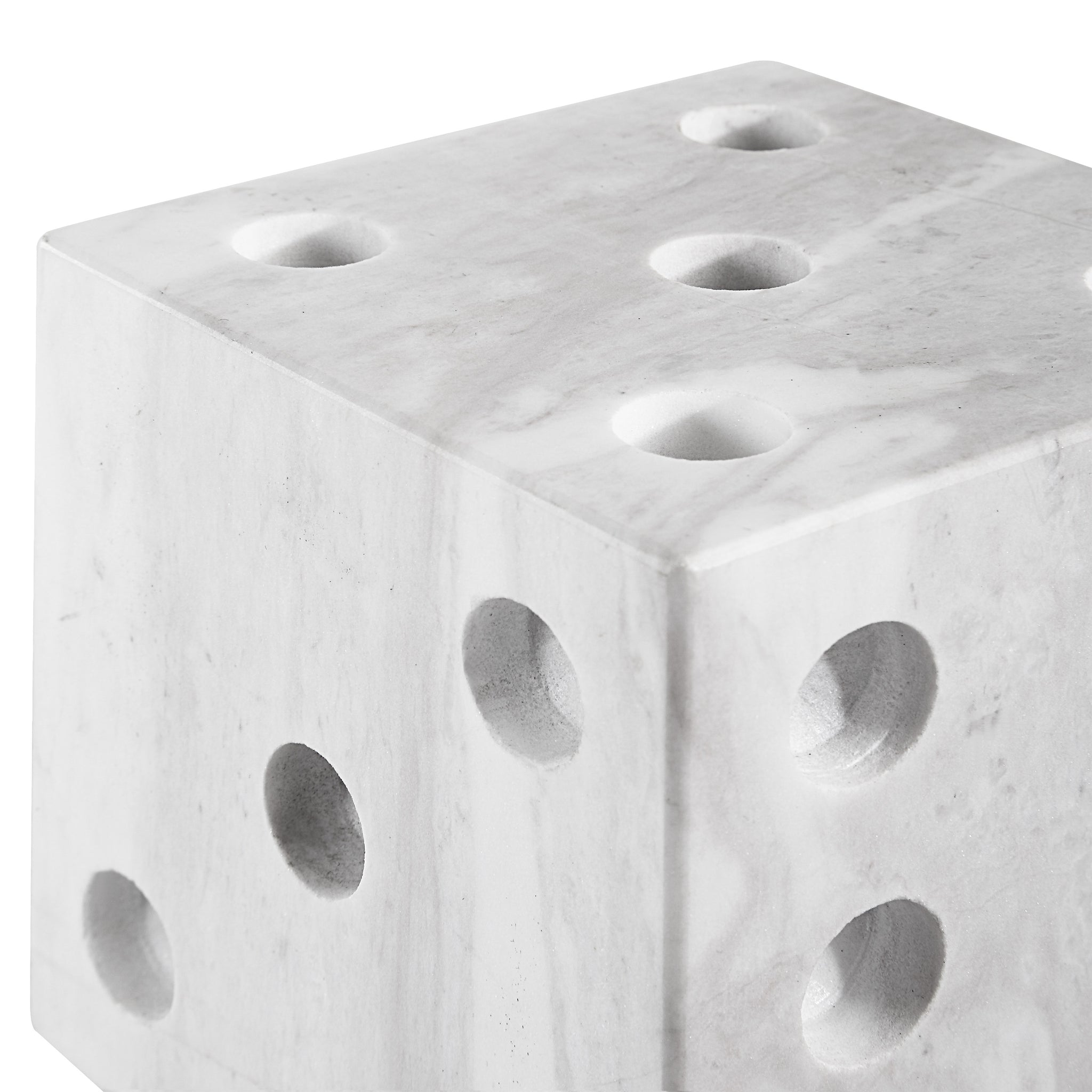 Dylon statue, marble cube featuring multiple holes, modern aesthetic