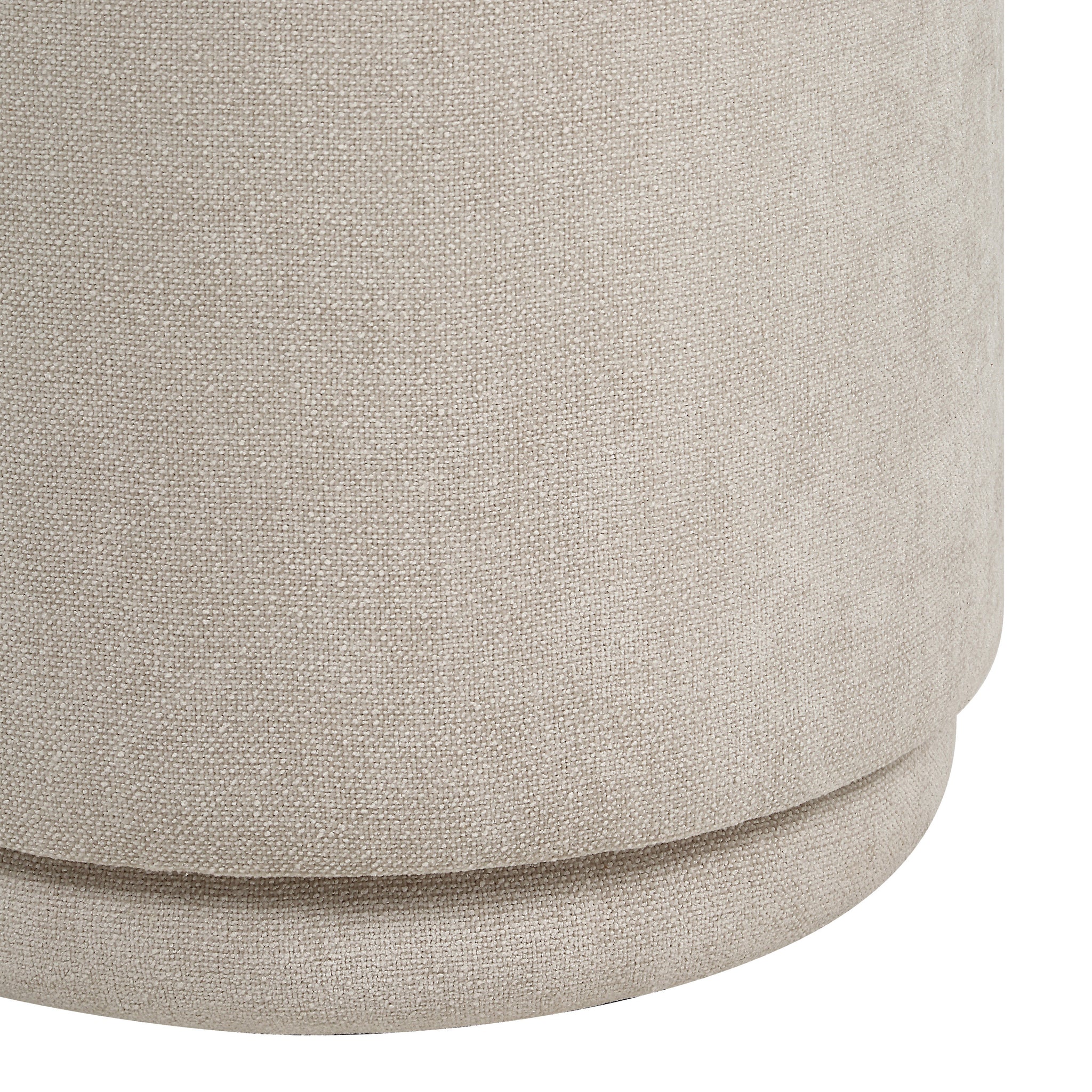 Close-up of Persea stool showcasing light beige fabric texture and rounded base.