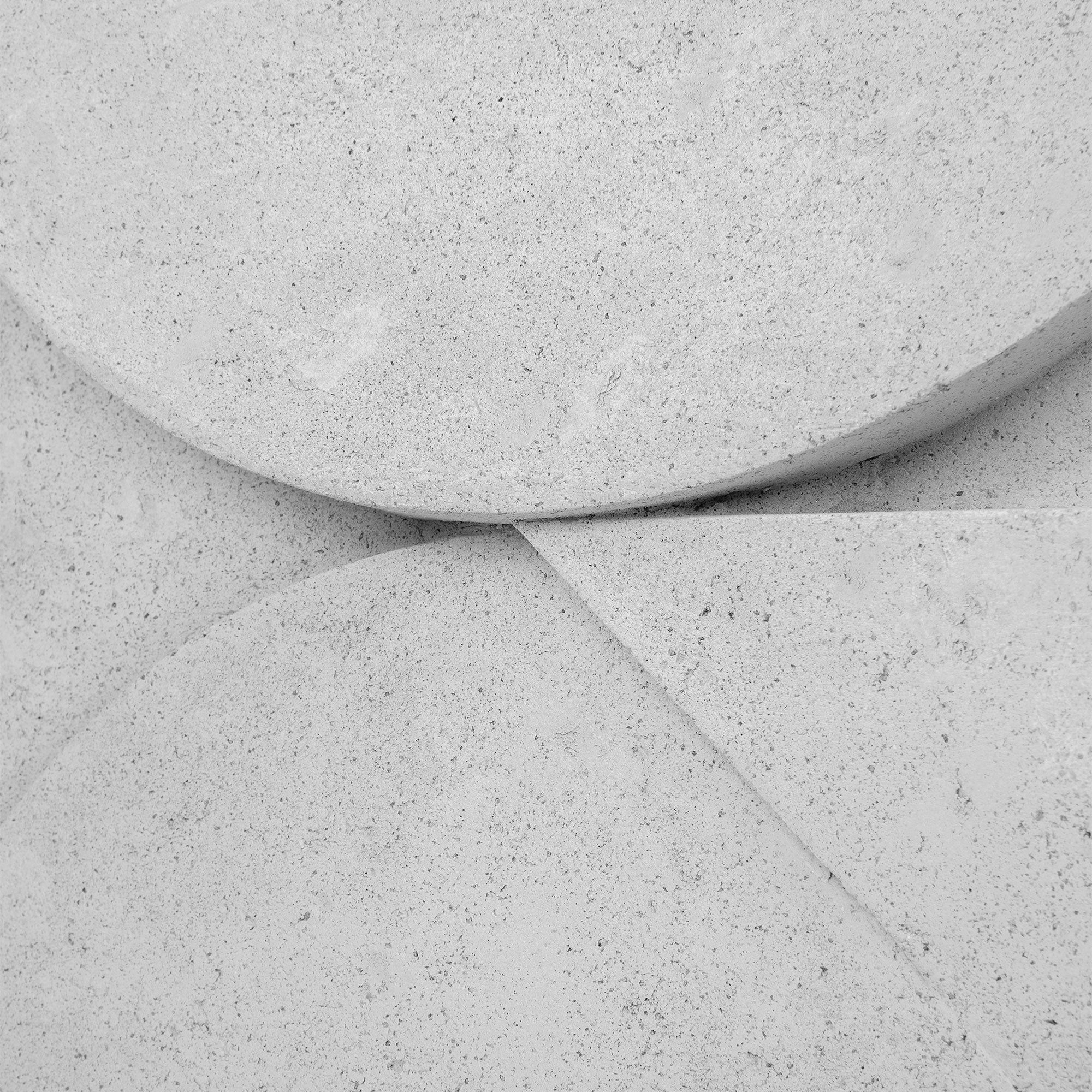 Sahara Wall Art featuring abstract shapes in textured white material, showcasing smooth curves and sharp angles.