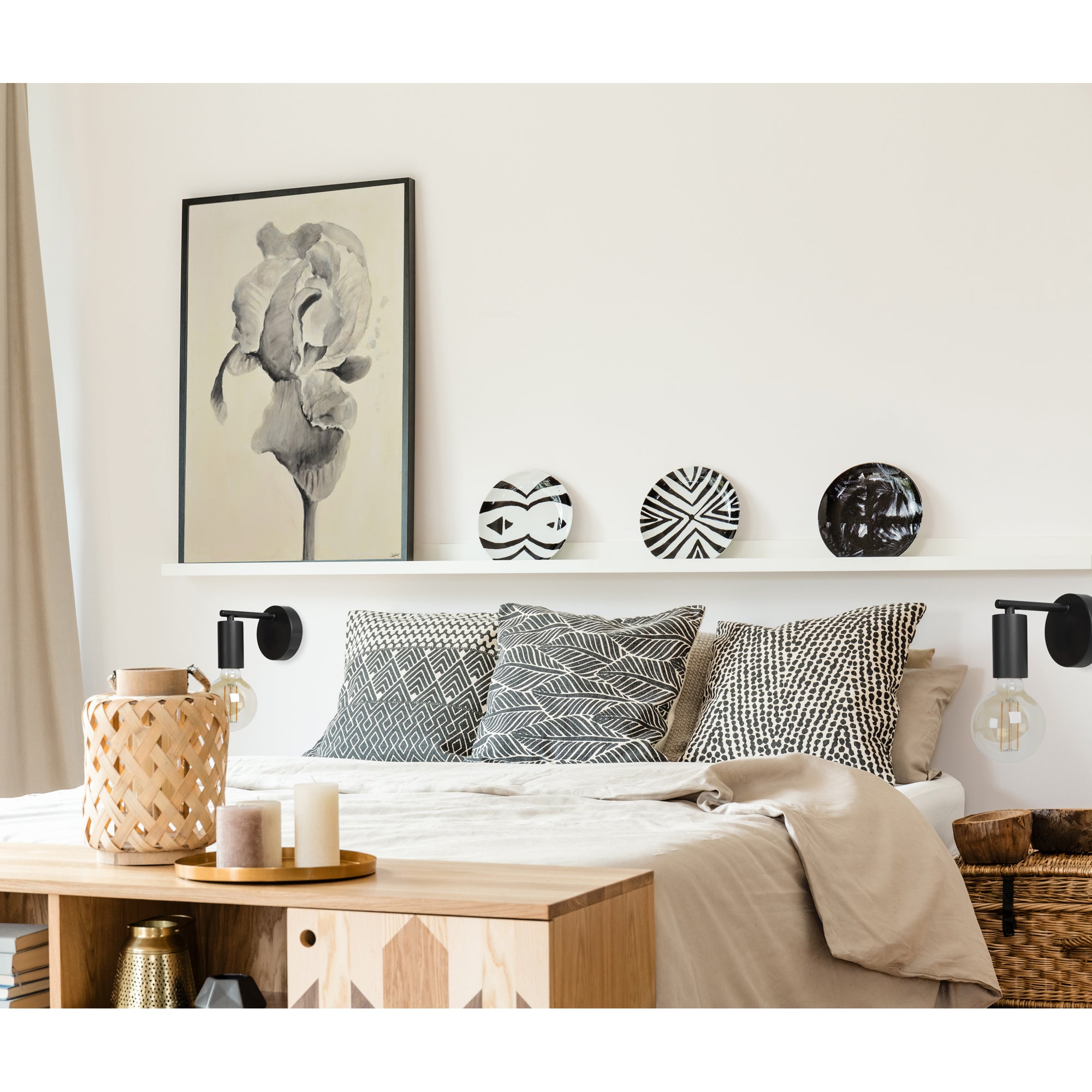 Think Wall Sconce styled in a modern bedroom with decorative pillows and wall art.