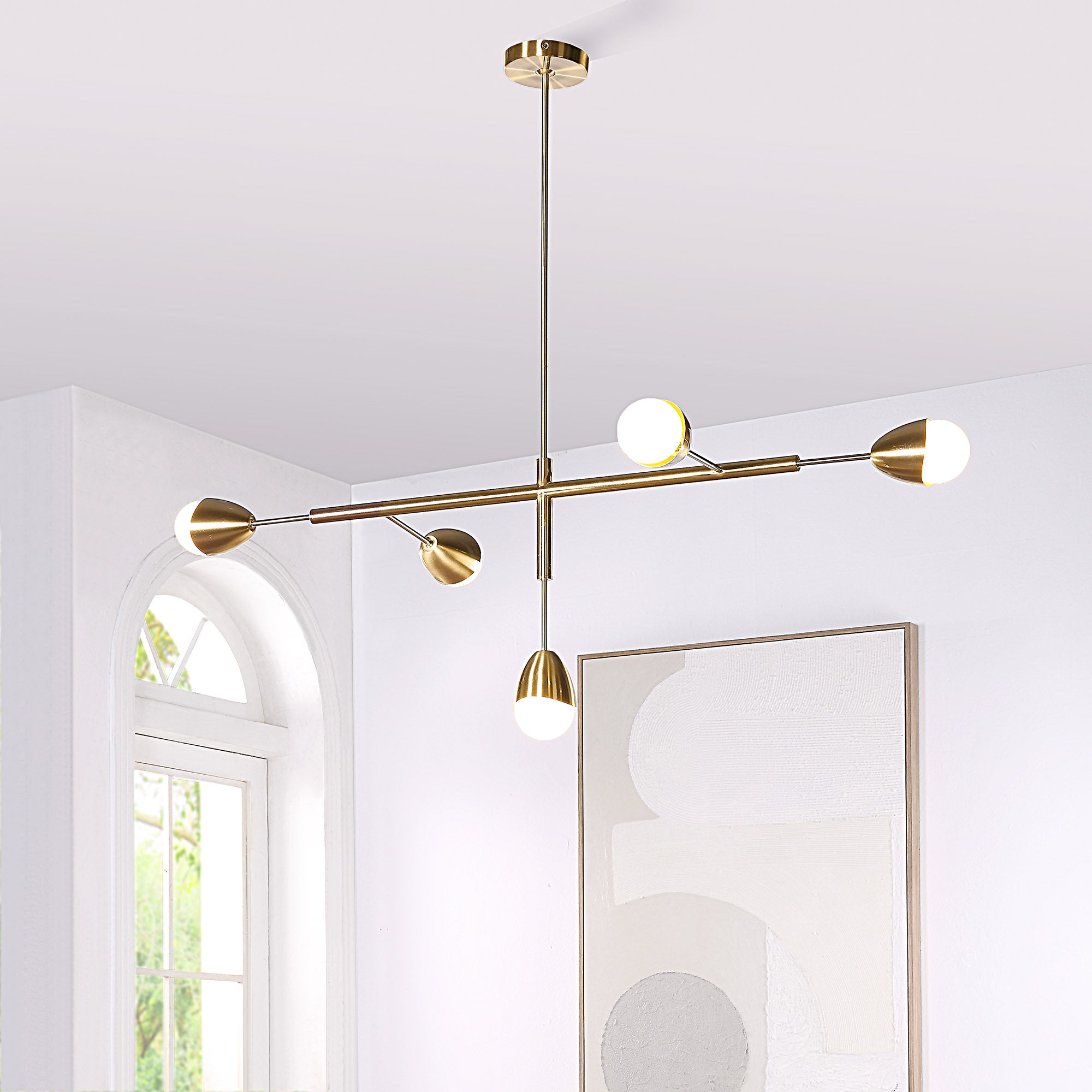 Naura Ceiling Fixture installed in a room, highlighting its gold finish and modern aesthetic