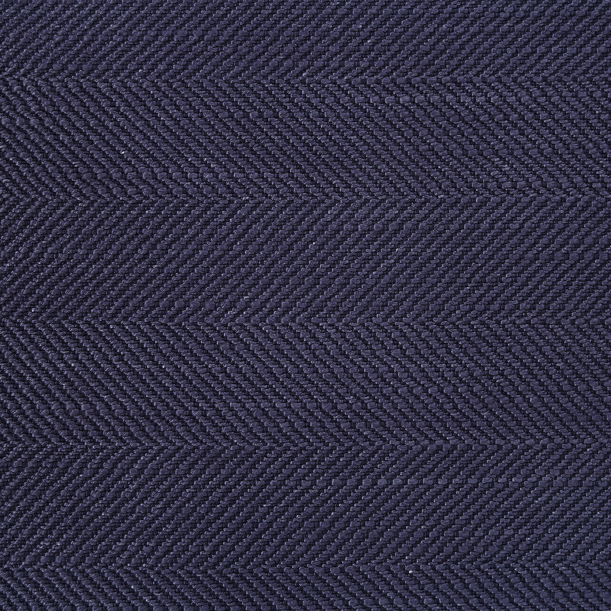 Close-up of Forester decorative pillow showcasing the dark navy herringbone texture.