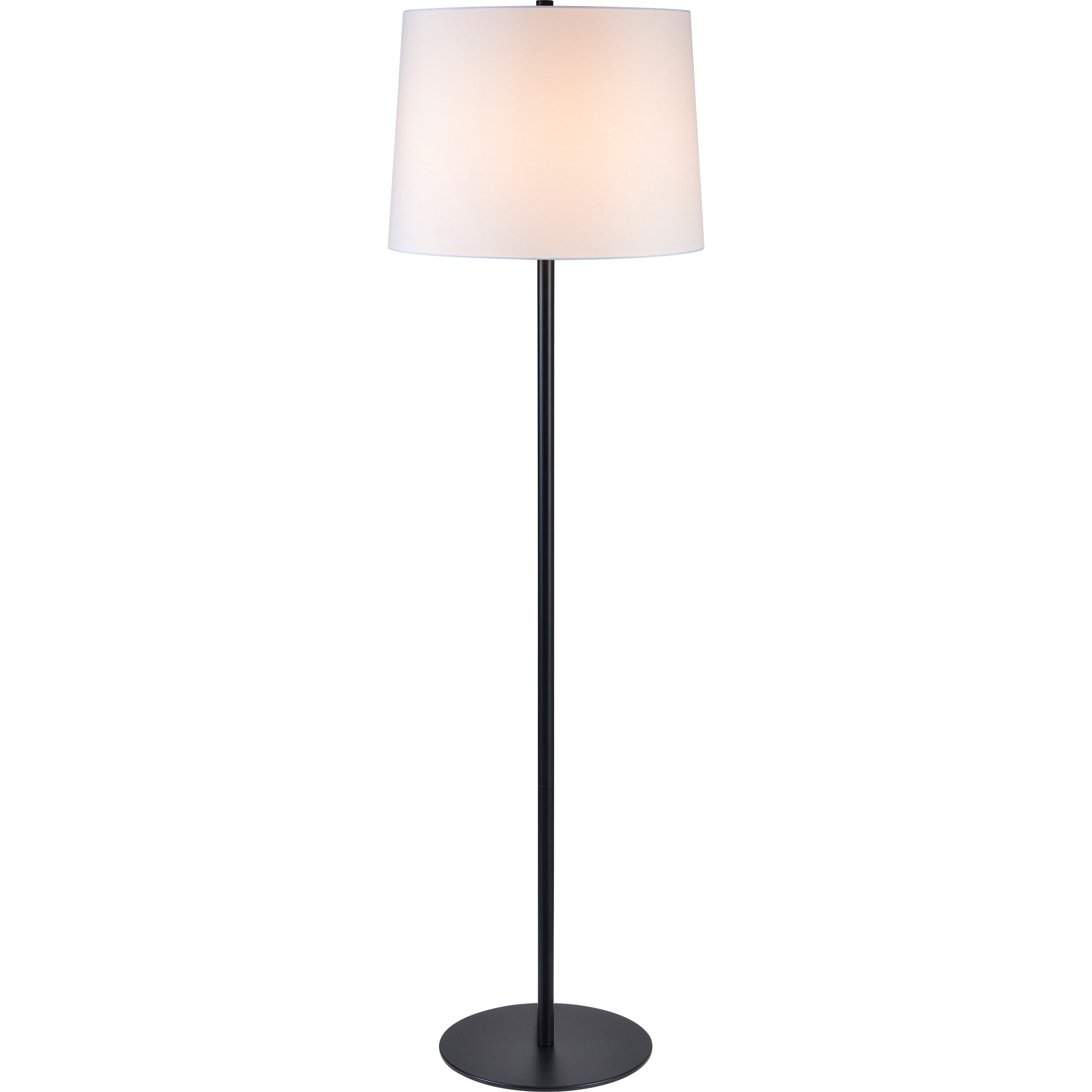 Nevin Floor Lamp with a lit white shade, standing in a stylish room.