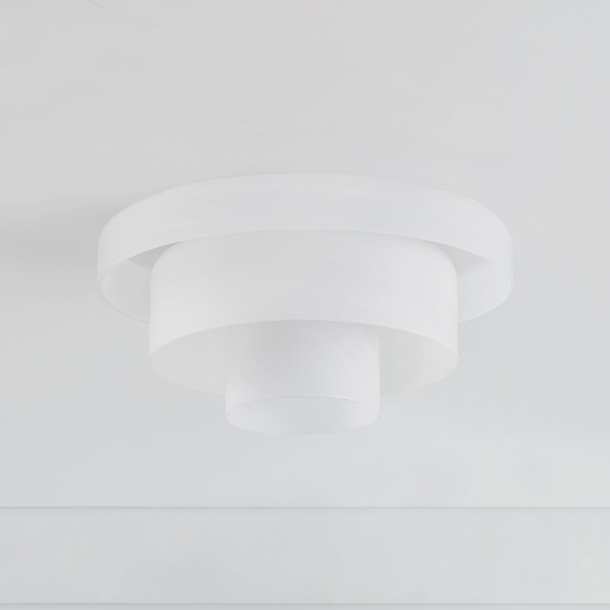 Port Richmond Flush Mount in aged brass shown from a second angle to highlight the shade profile and mounting canopy.