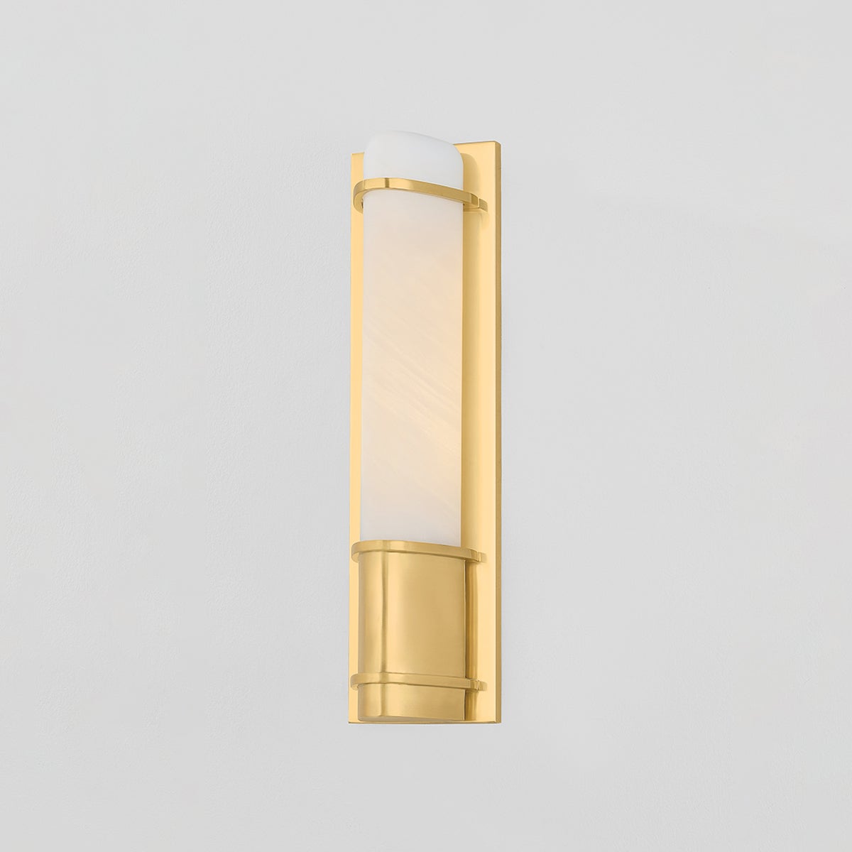 Close-up of the Tottenville Wall Sconce 4.25" x 16.25" in aged brass showing the arm curve and shade silhouette.