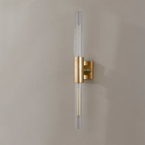 Close-up of the Asher Wall Sconce 4.25" in aged brass showing the arm curve and shade silhouette.