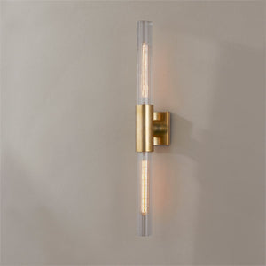 Close-up of the Asher Wall Sconce 4.25" in aged brass showing the arm curve and shade silhouette.