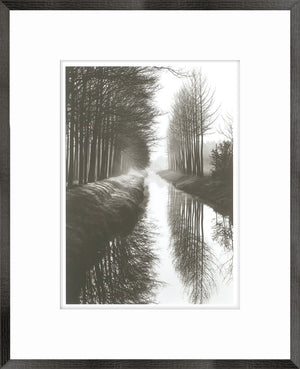 Holland Canal wall art featuring a serene black and white landscape with trees and water reflections
