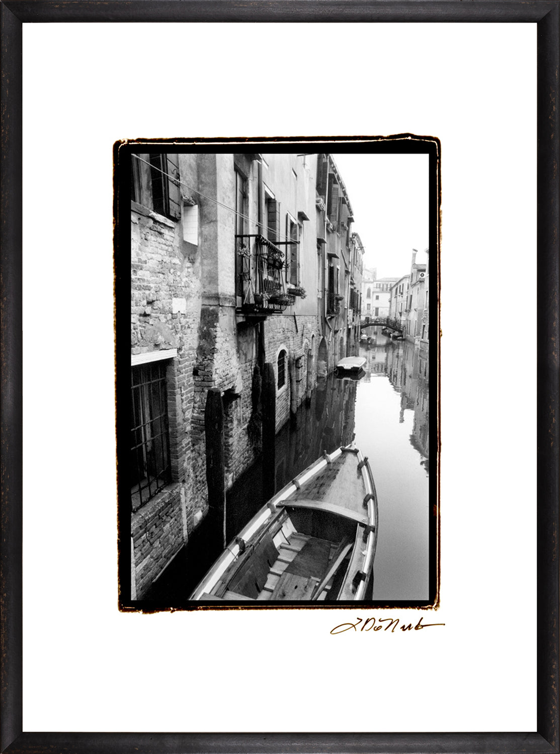 Waterways Of Venice V wall art featuring a black and white canal scene with a boat.