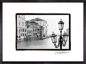 Waterways Of Venice XI wall art featuring a black and white photo of Venetian buildings and street lamps.