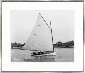 Wanda wall art featuring a black and white photograph of a sailboat on water.