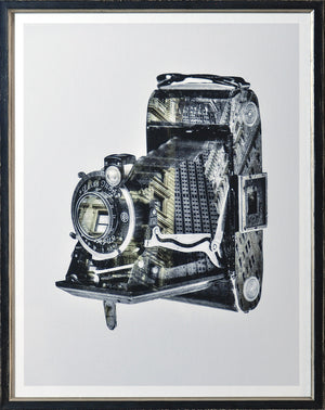 Vintage Camera I wall art featuring a detailed black and white camera design with urban elements.