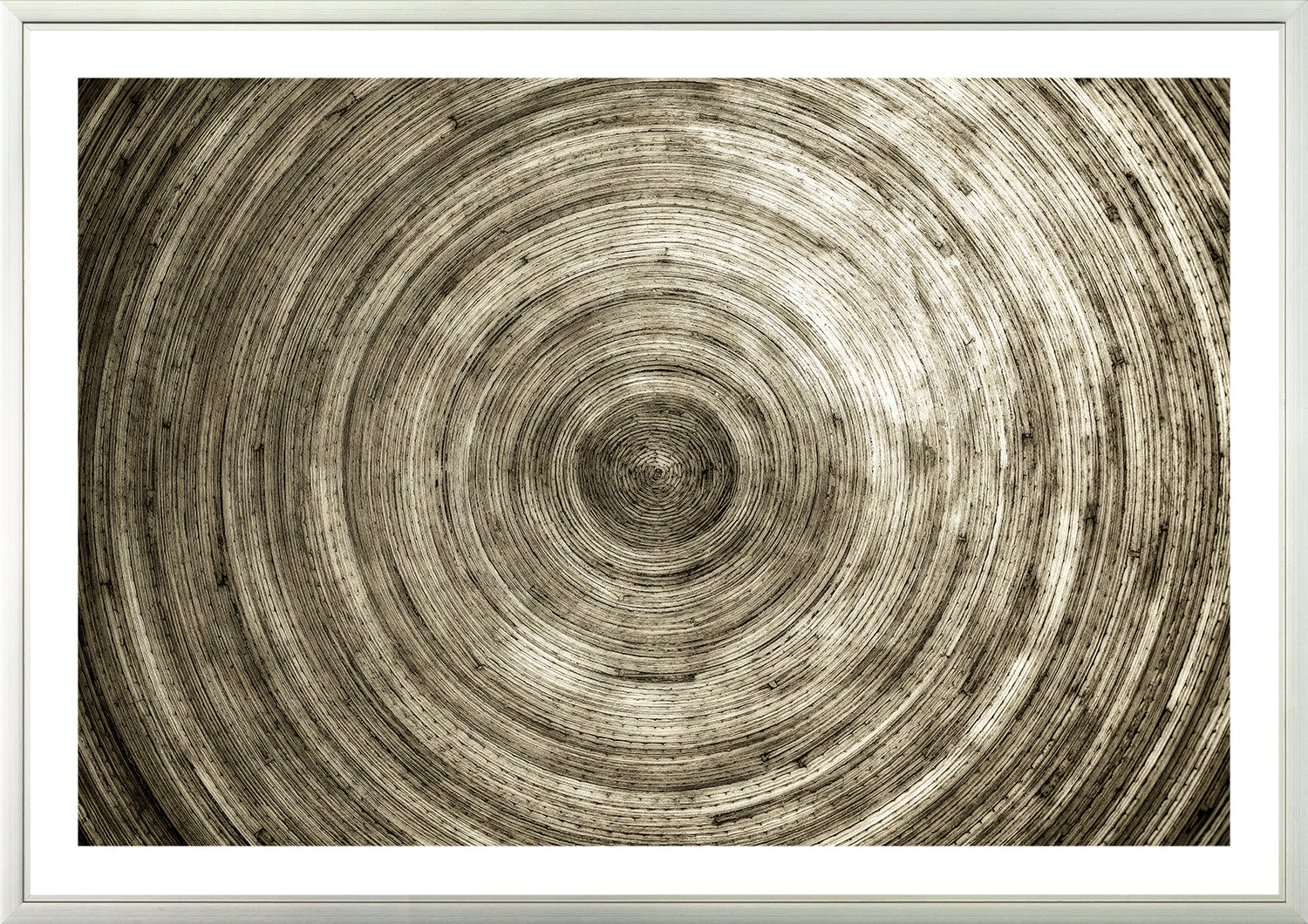 Construct – Bamboo Round wall art featuring concentric circular patterns in earthy tones.