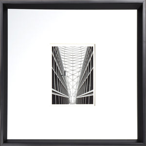 Architecture wall art featuring a black and white geometric design of a building interior.