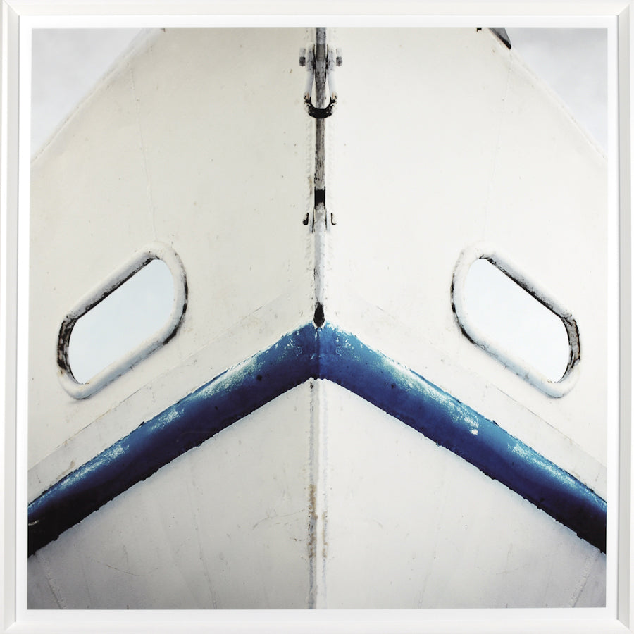 Boat Bow wall art featuring a close-up of a white boat's bow with blue accents and windows.