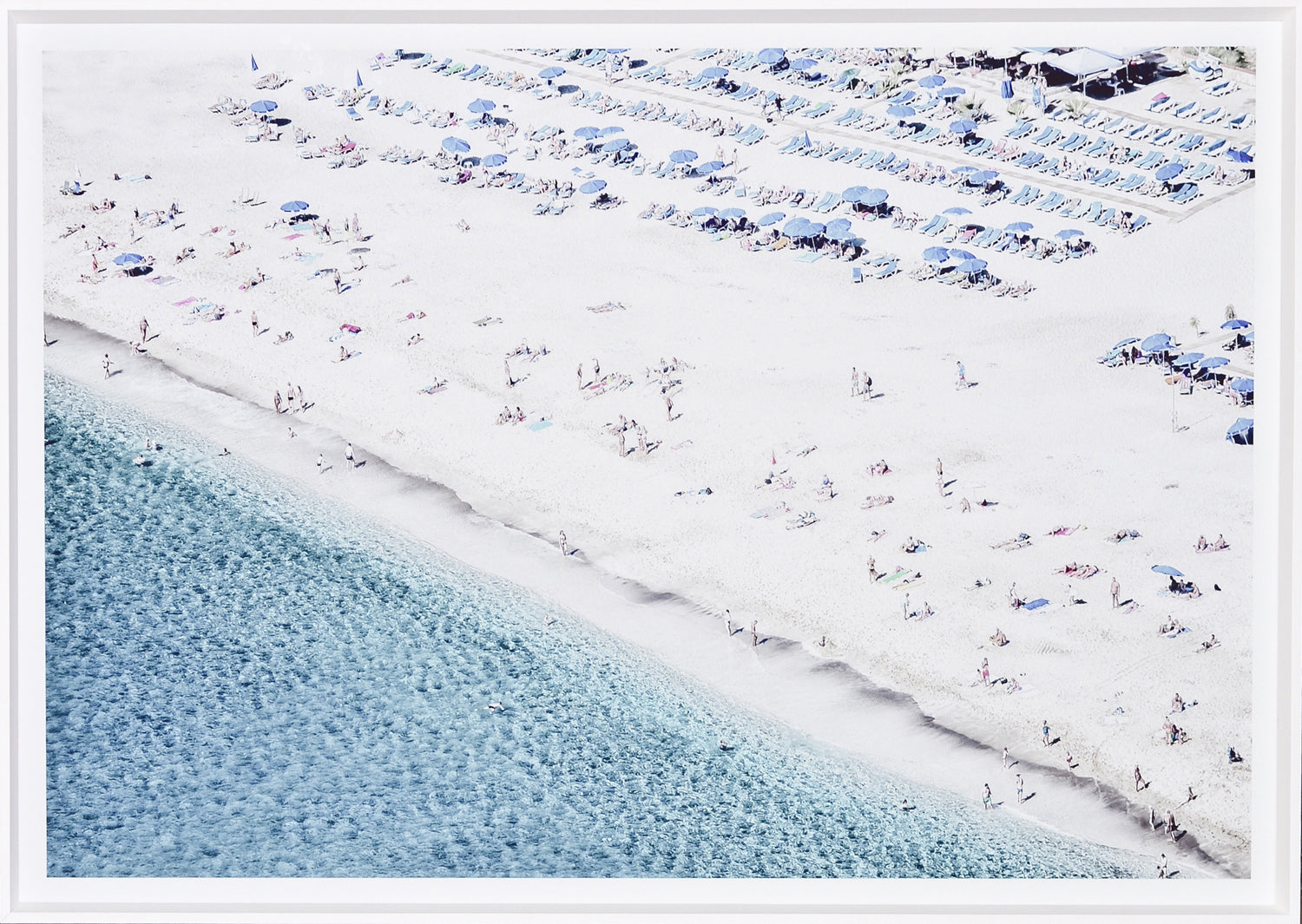 Aerial Beach View # 2 featuring a sandy beach with umbrellas and sunbathers, clear turquoise water, and a vibrant atmosphere.