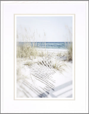 Dune Vista II wall art featuring a serene beach scene with sand, grass, and ocean waves, framed in white.