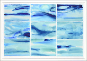 Tidal Motion wall art featuring abstract blue watercolor patterns in a white frame.