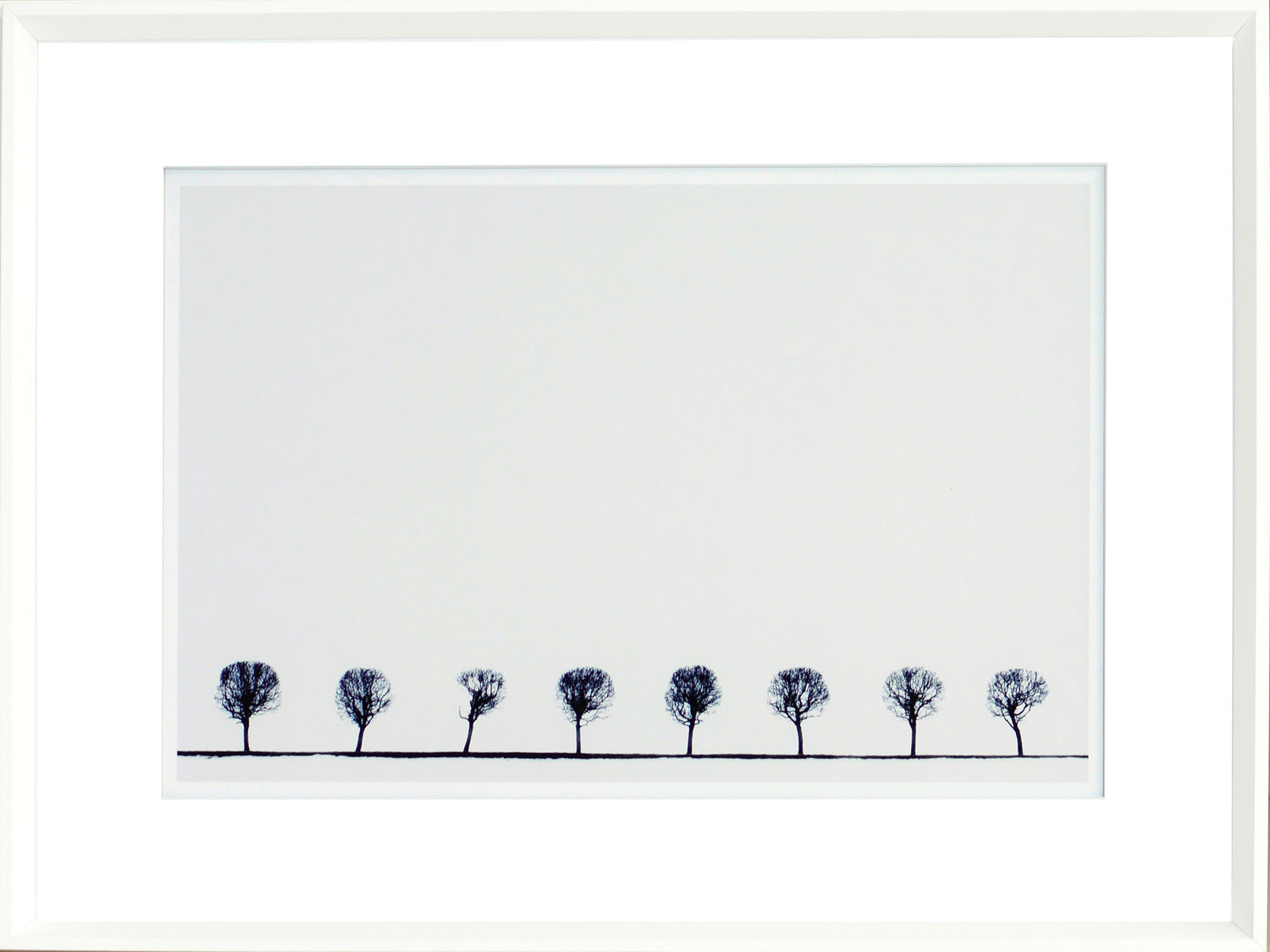 Indigo Landscape Series V wall art featuring a row of silhouetted trees against a white background.