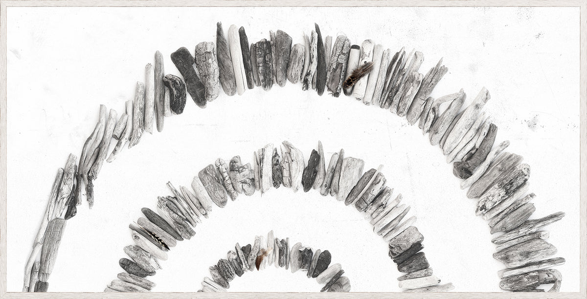 Driftwood Rainbow – Left wall art featuring a circular arrangement of gray driftwood pieces.