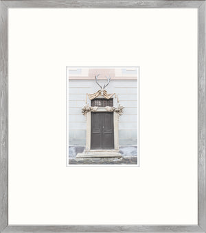Pastel Revival Series XVI wall art featuring a decorative door with antlers and intricate stonework.