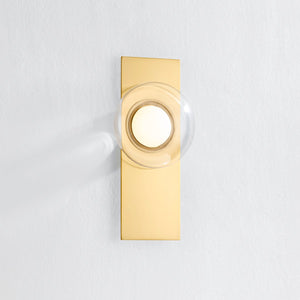 Close-up of the Pound Ridge Wall Sconce in aged brass showing the arm curve and shade silhouette.