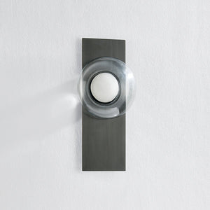 Close-up of the Pound Ridge Wall Sconce in dark bronze showing the arm curve and shade silhouette.