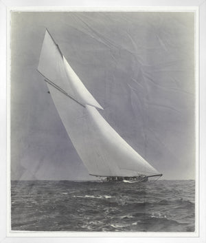 Indigo Stained – Yacht Columbia wall art featuring a sailboat with white sails on the ocean.
