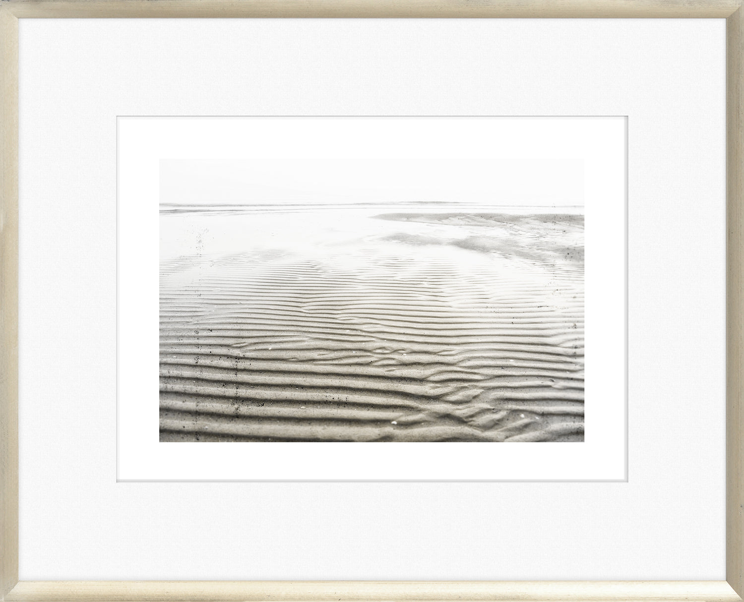 Taupe Aspect II wall art featuring textured sand patterns in black and white, framed in a light wood frame.